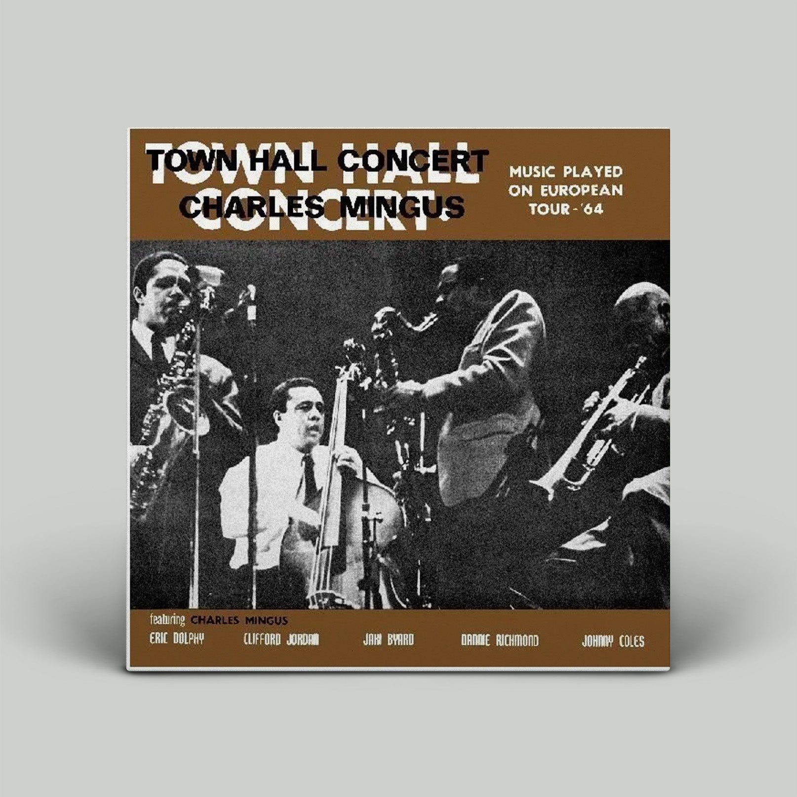 Album cover for Charles Mingus' Town Hall Concert with musicians on a gray background