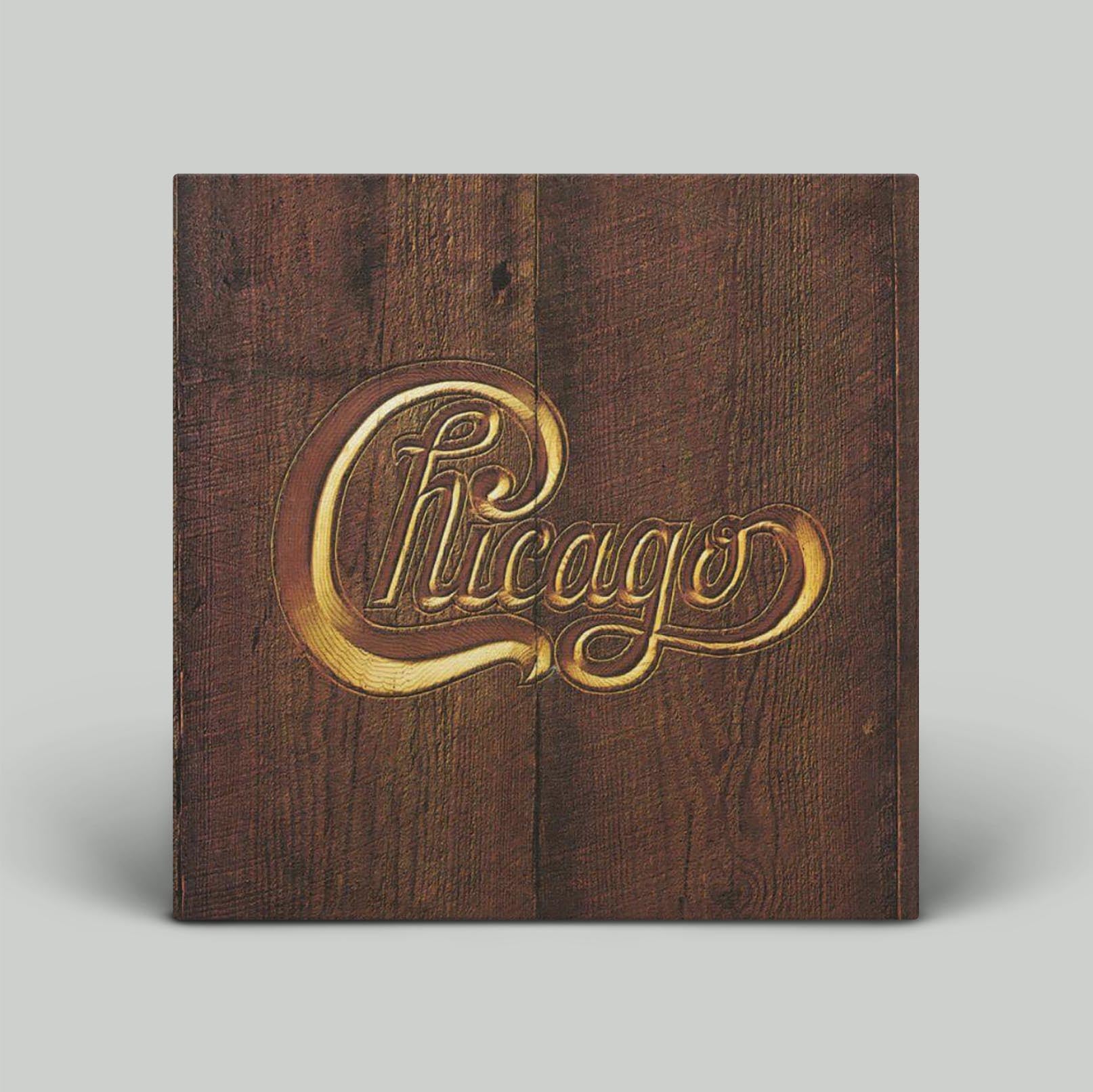 A vinyl record titled 'Chicago' with a wood grain background and the band's logo in gold lettering.
