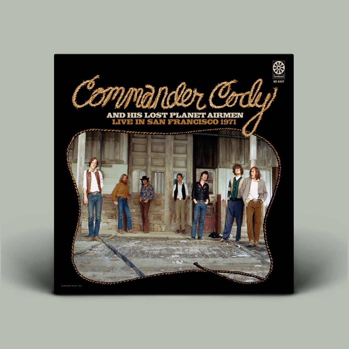 Album cover for 'Commander Cody and his Lost Planet Airmen Live in San Francisco 1971' with a group photo on a gray background.