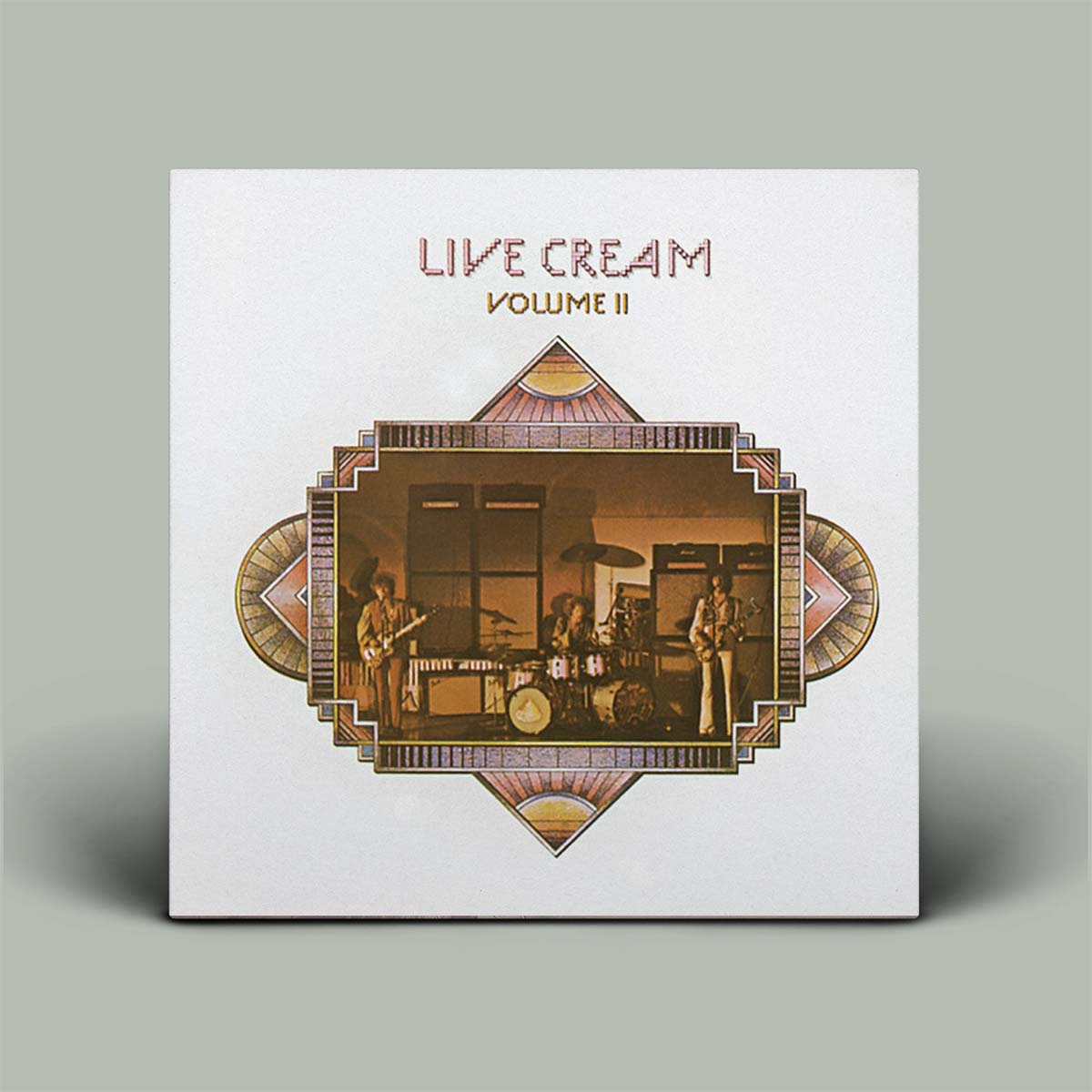 The image shows the album cover of 'Live Cream Volume II' featuring a band performing, with the members visible playing their instruments.