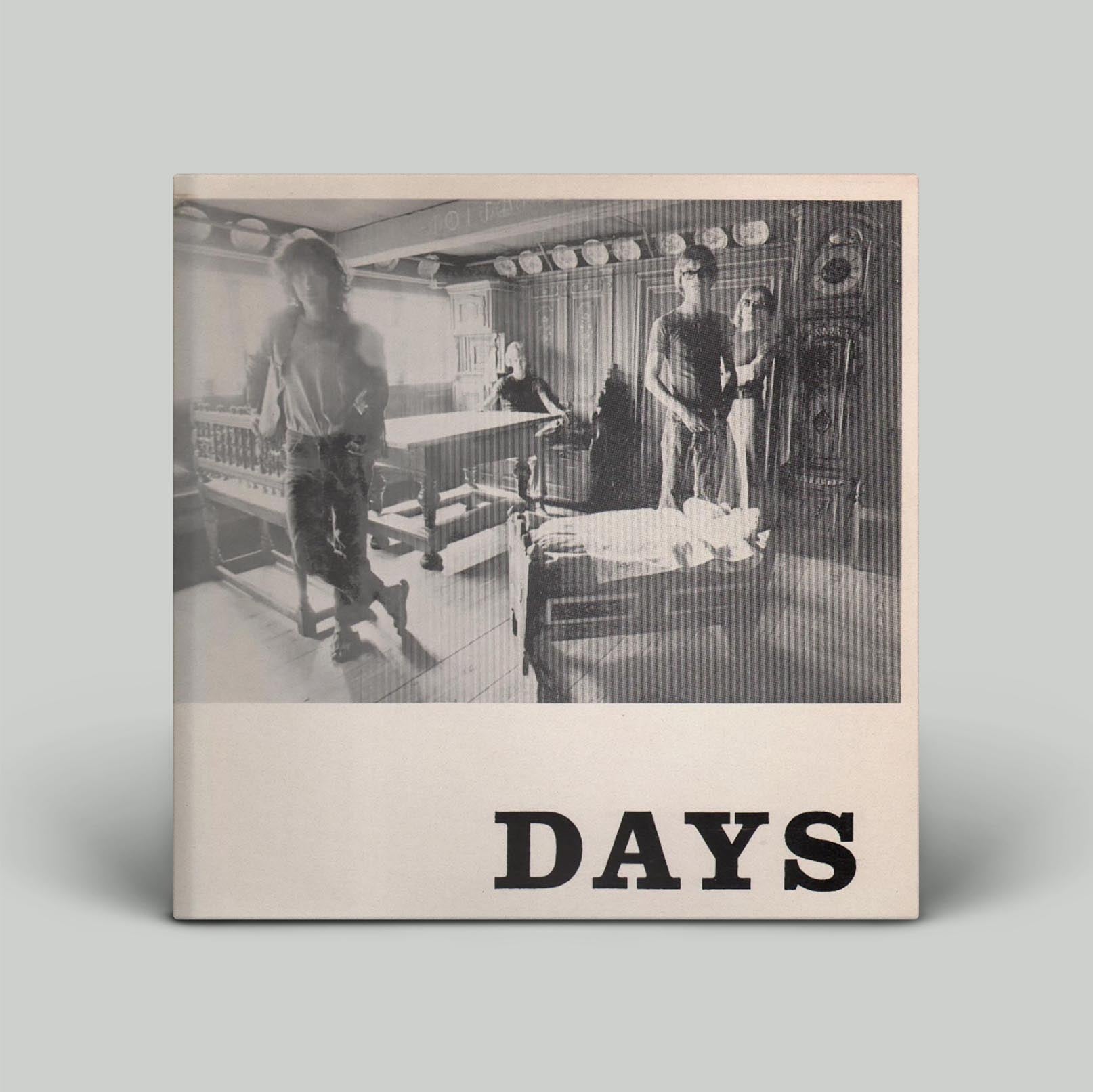 Album cover has black & white photograph of people with word days on white background.