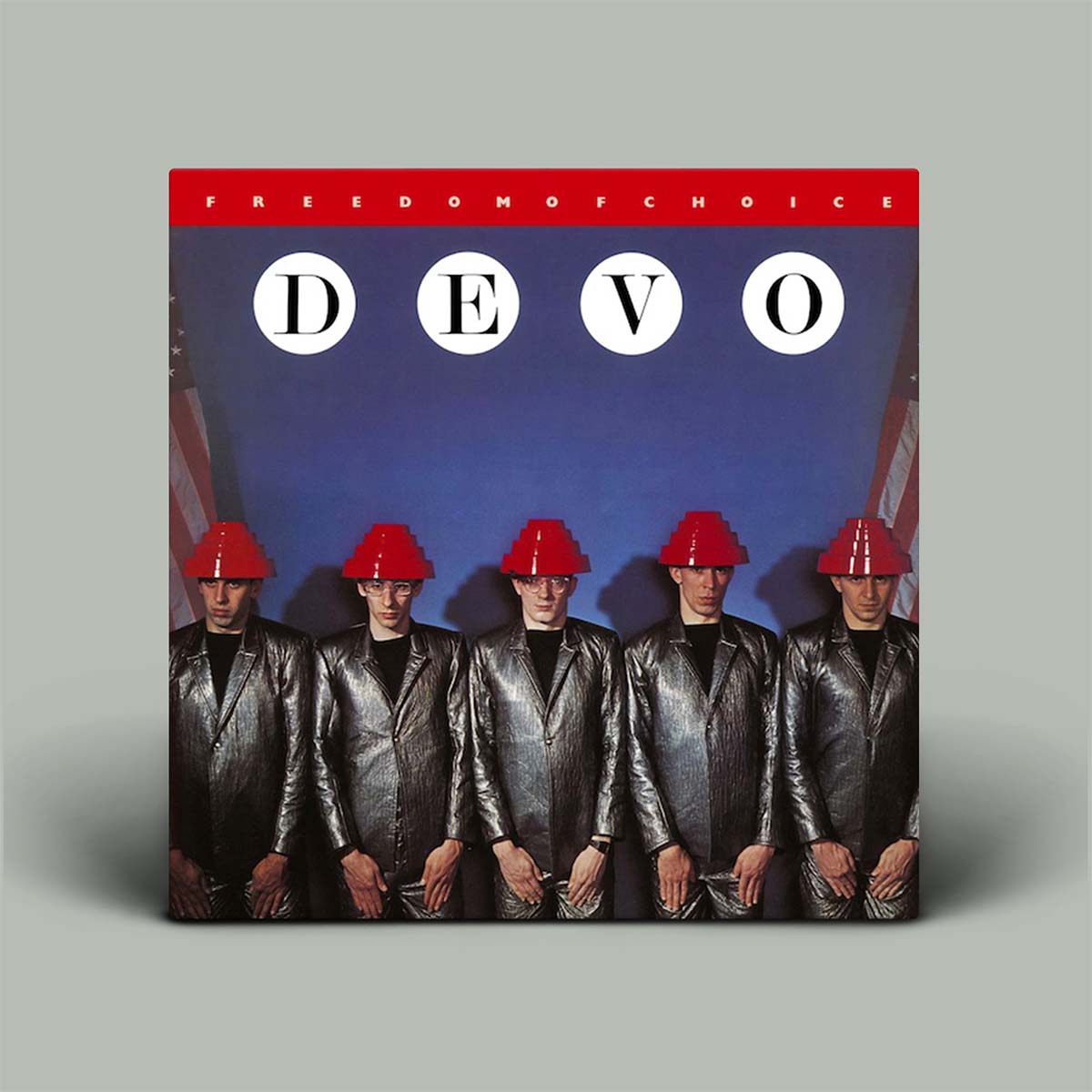 Album cover of DEVO's 'Freedom of Choice' with five people in red hats and shiny suits.