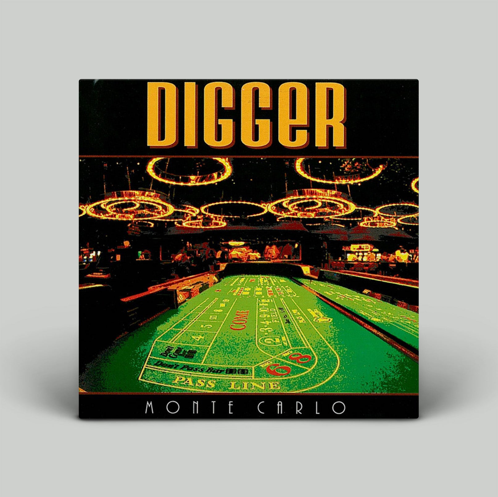 Casino craps table with 'Digger' and 'Monte Carlo' text on a black border.