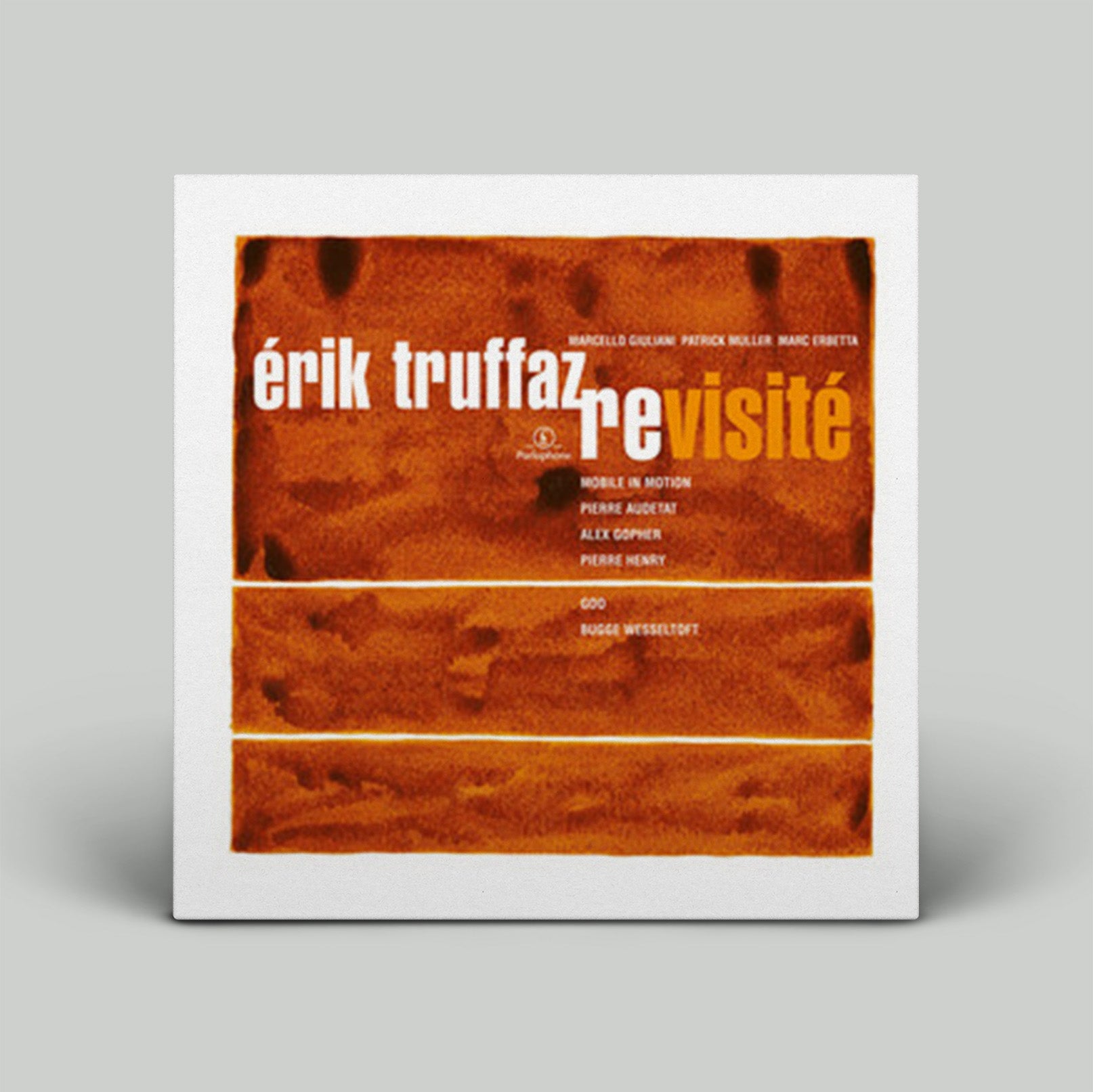 Album cover with 'Erik Truffaz revisite' text on a brown background
