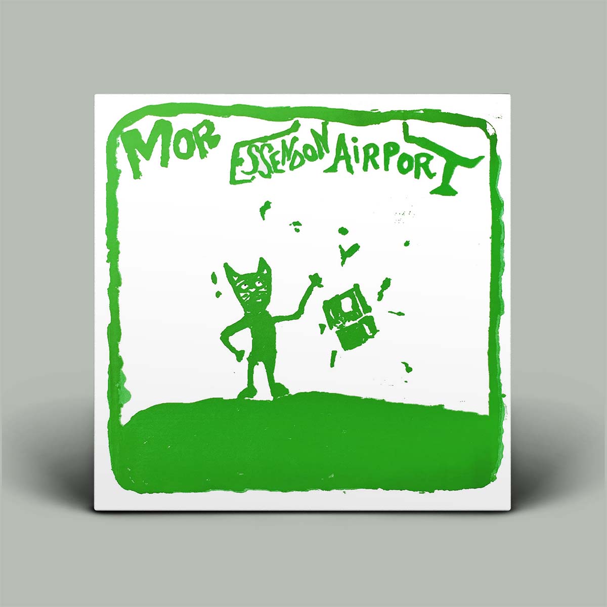 A square album-style cover or print with a white background and bold green graphic artwork. The top text reads 'MOR EDITION AIRPORT' in green, and the lower portion shows a green silhouette of a cat-like figure standing on a grassy shape while holding a suitcase.
