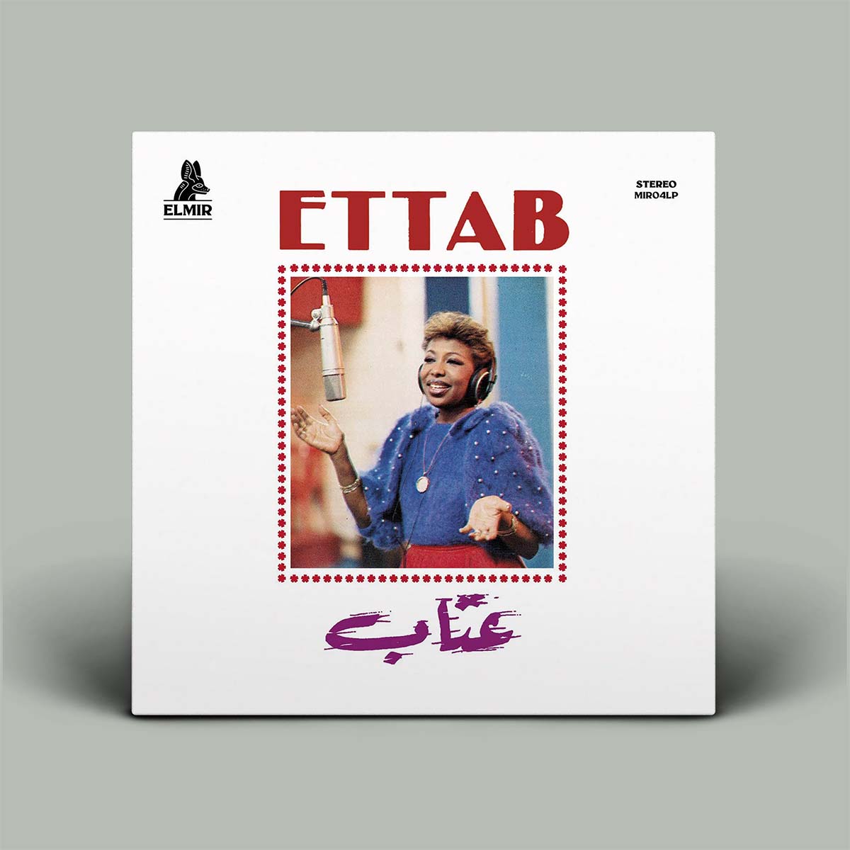 Album cover for 'ETTAB' with a person holding a microphone on a gray background