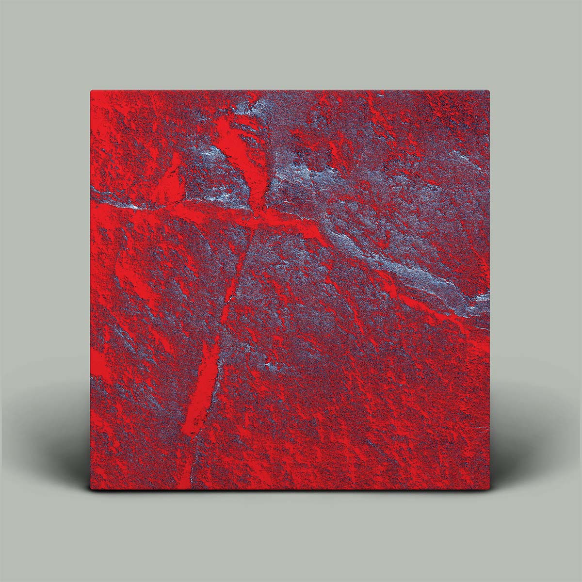 Square piece of red and blue marbled material on a gray background