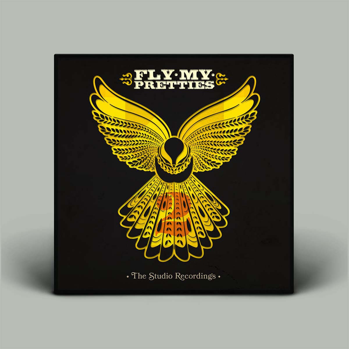 Album cover with yellow owl design and text on a black background