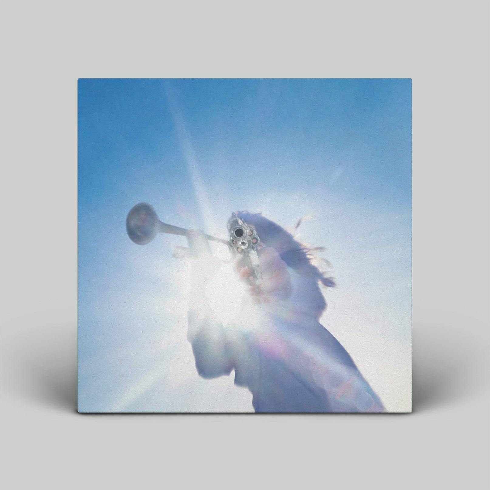 Album cover with a trumpet and abstract design on a blue background