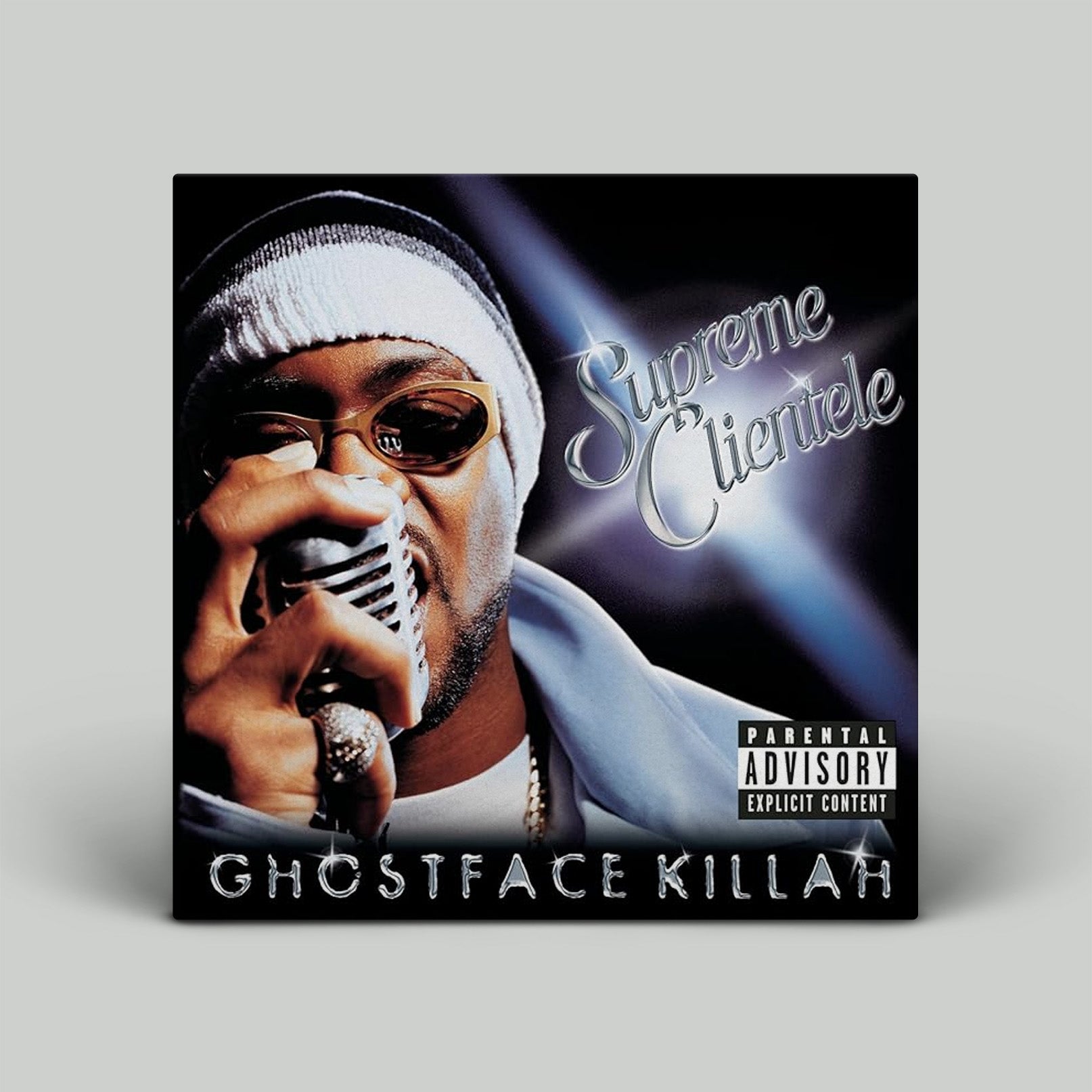 Album cover of 'Supreme Clientele' by Ghostface Killah with a person holding a microphone.