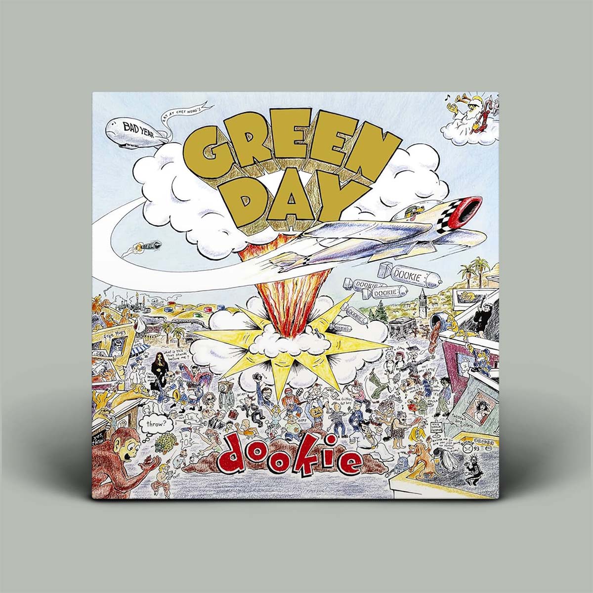 Album cover for Green Day's 'Dookie' with colorful graphics and text.