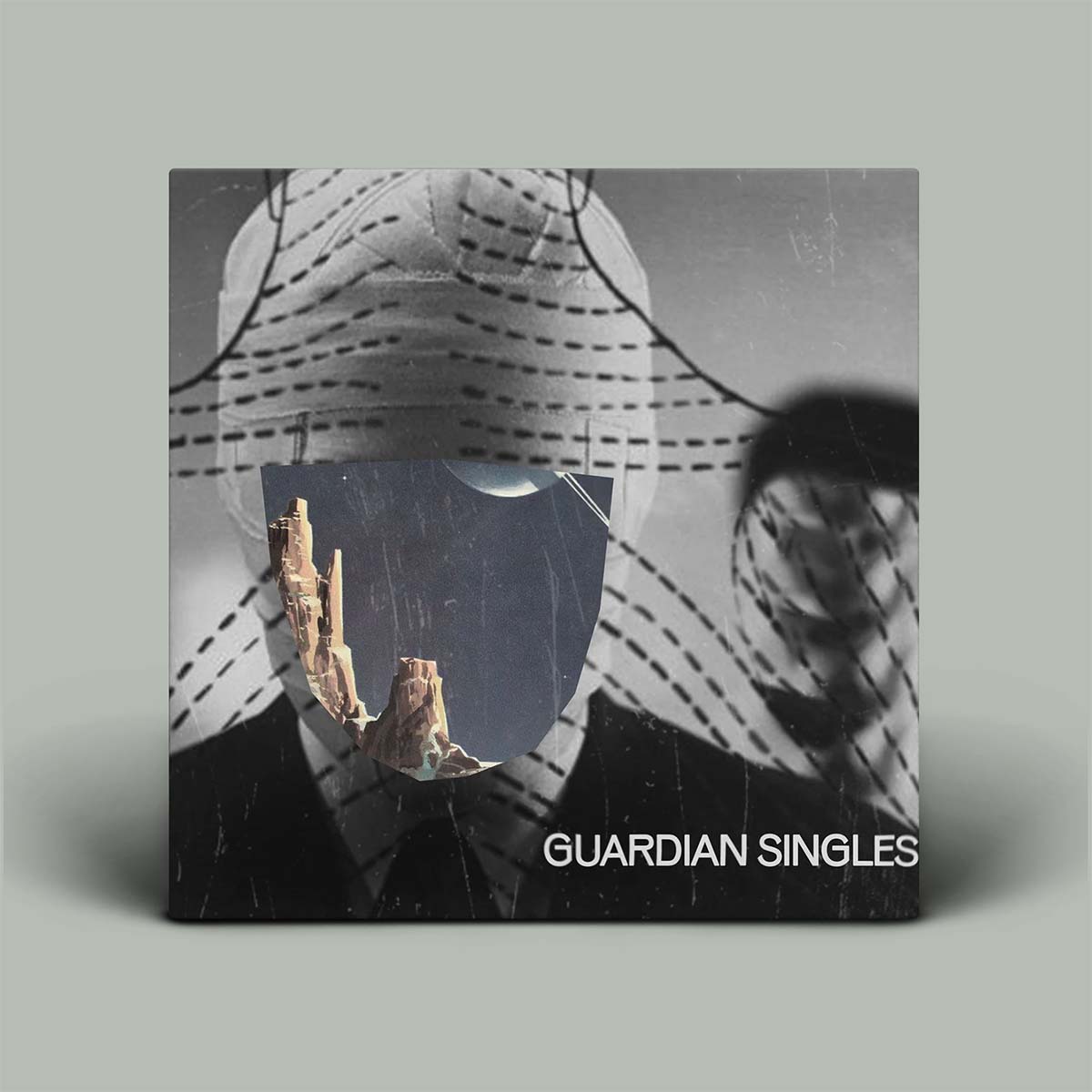 Album cover for 'Guardian Singles' with a stylized portrait and desert landscape.
