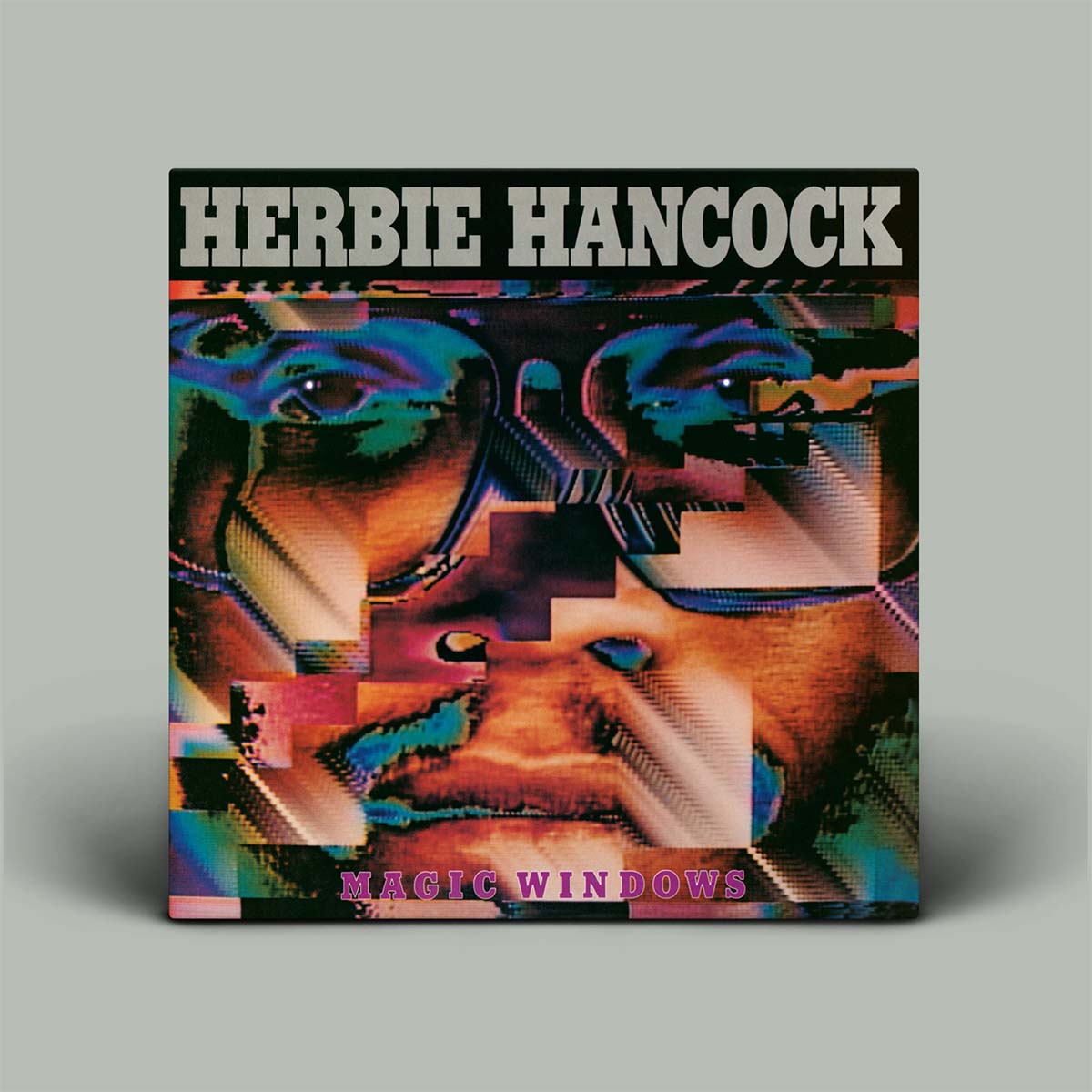 Album cover for Herbie Hancock's 'Magic Windows' with colorful abstract design.