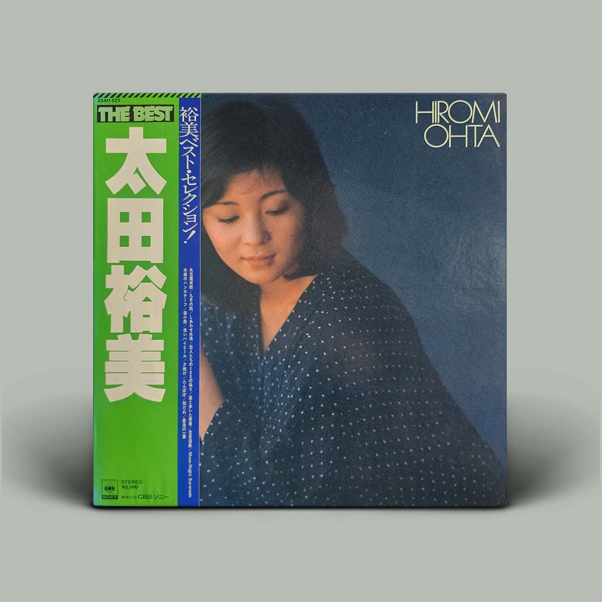 Album cover with a woman's portrait and text on a gray background