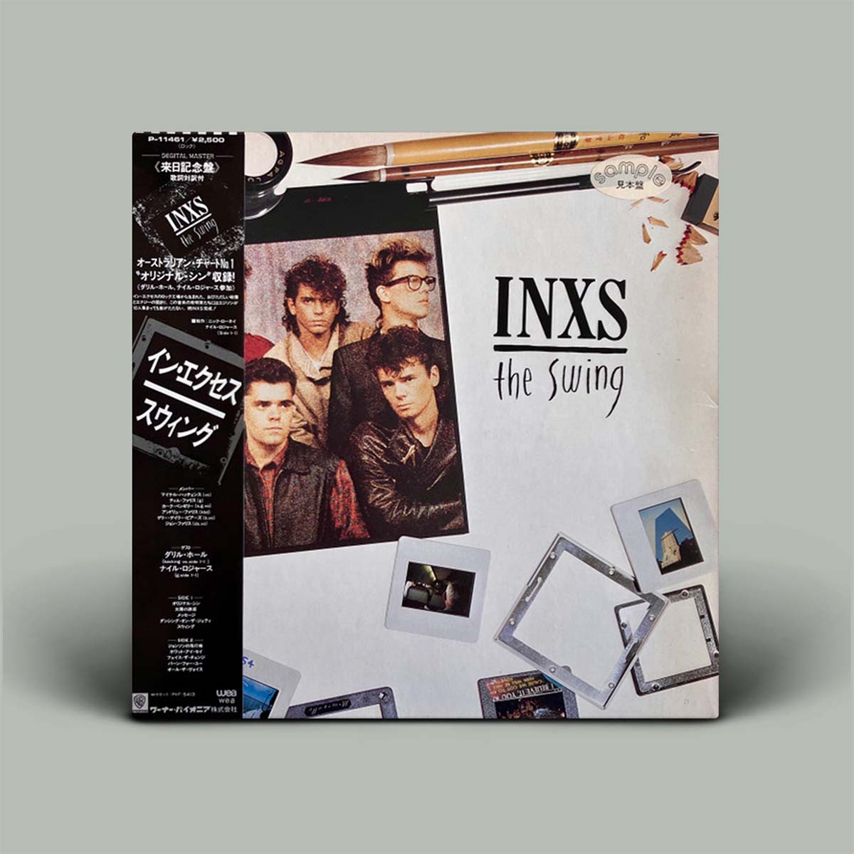 Vinyl record cover for INXS' 'The Swing' with band members and album design elements.