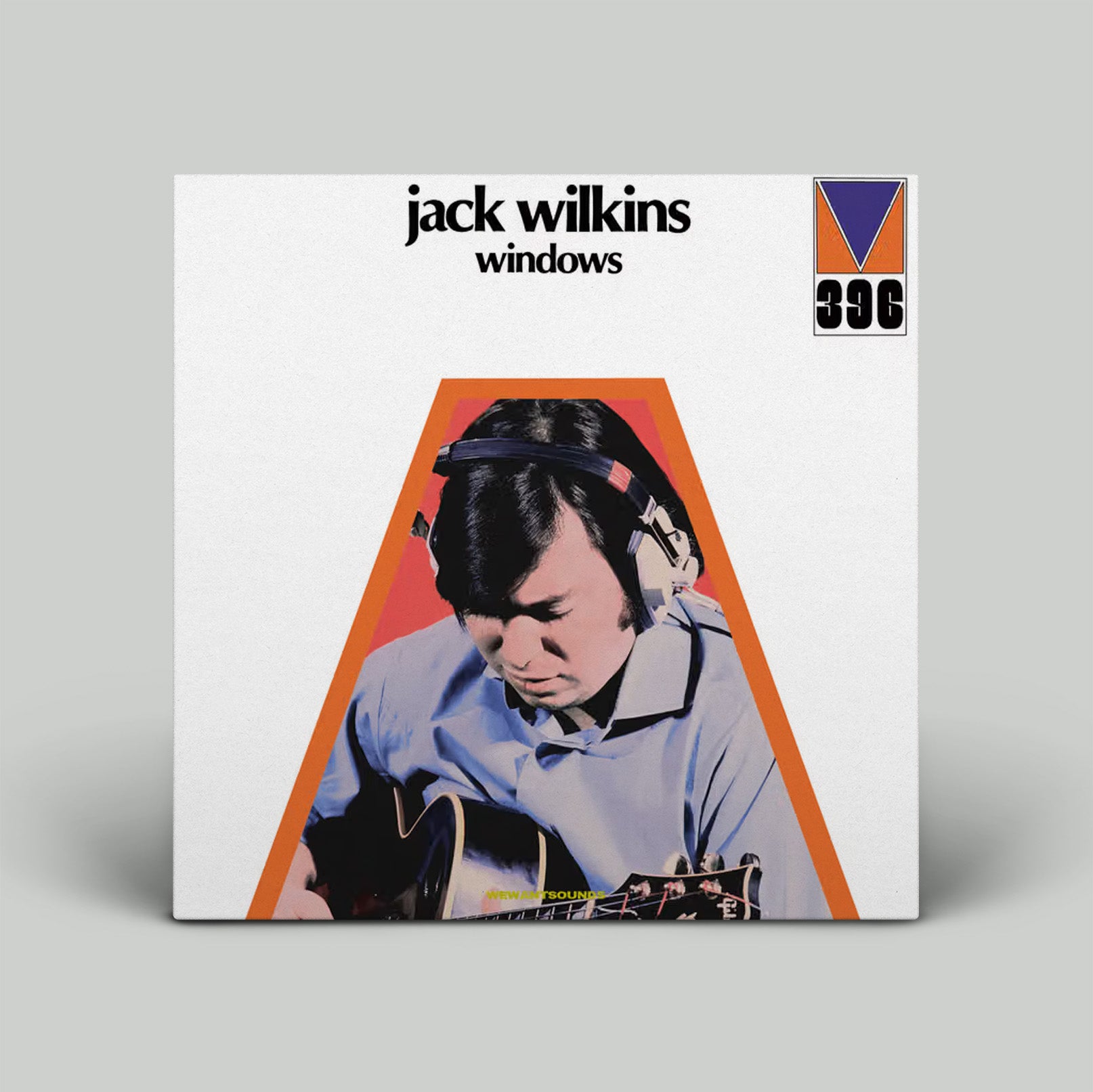 Album cover of 'Windows' by Jack Wilkins with a person holding a guitar on a white background.