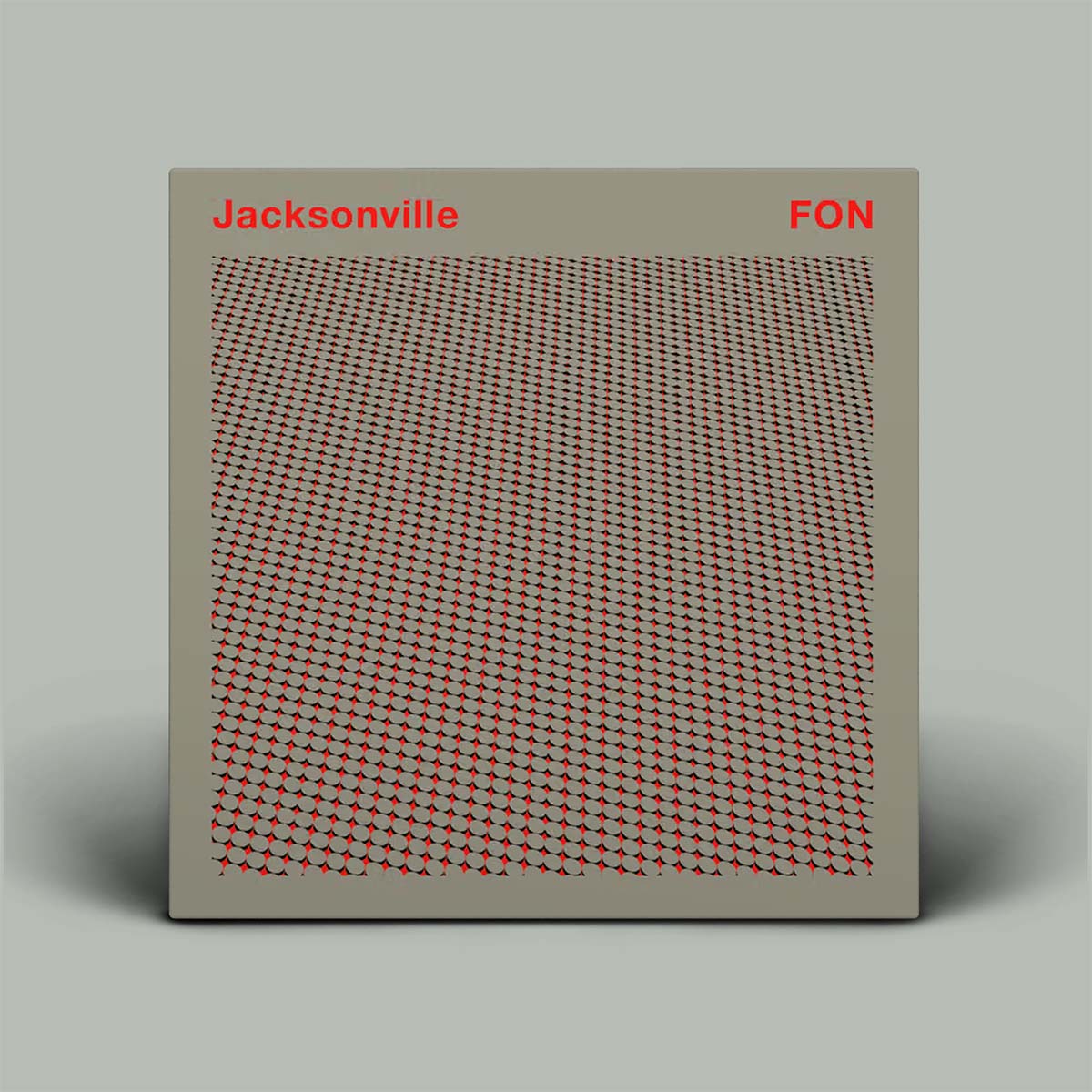 Book or album cover with geometric pattern and text on a gray background