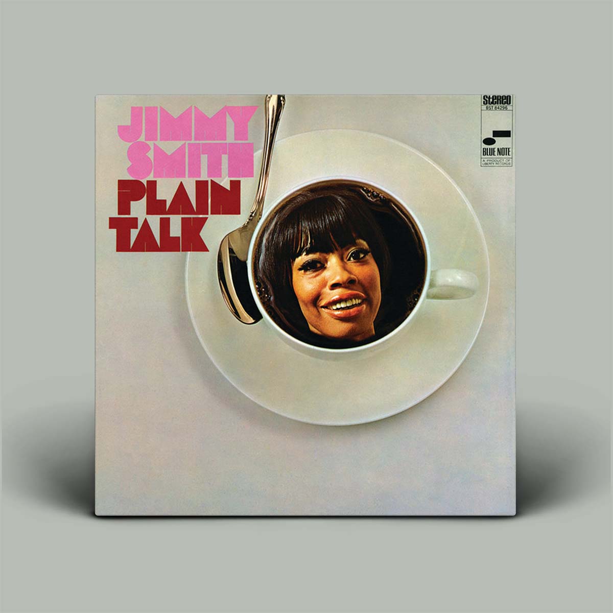 Vinyl record cover for 'Plain Talk' by Jimmy Smith with a smiling face inside a coffee cup.