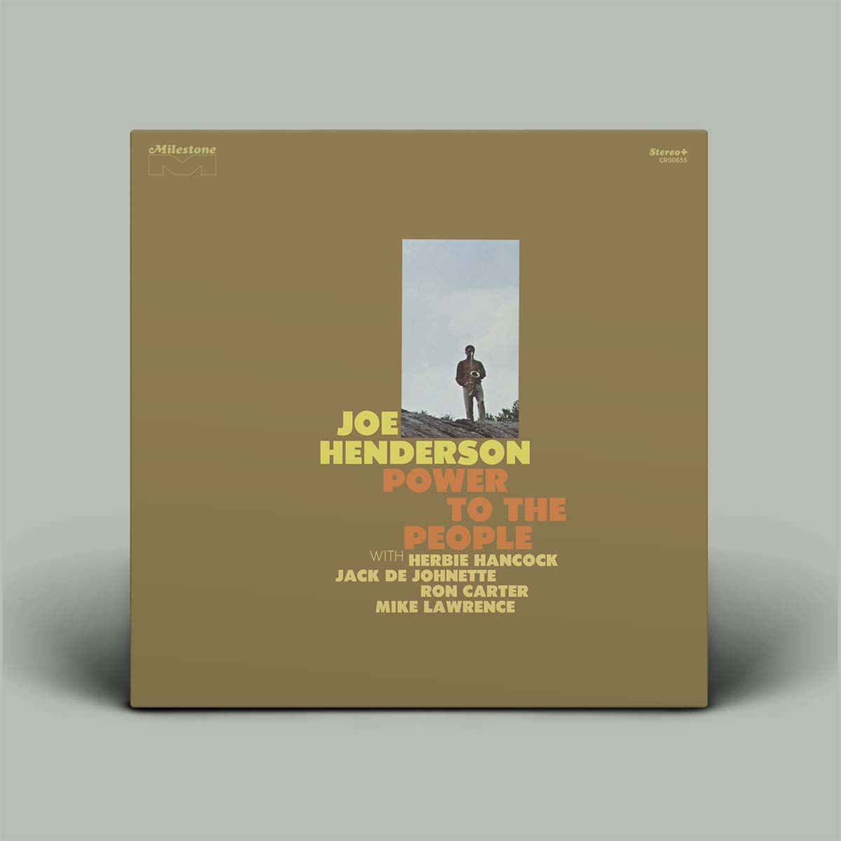 Joe Henderson 'Power to the People' vinyl record album cover, featuring a muted olive-brown background with a central vertical photo of a lone figure and yellow and orange text, shown standing against a light gray background.