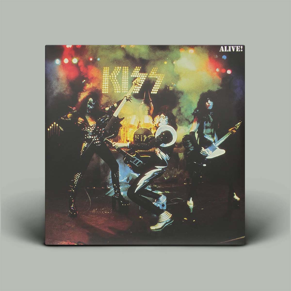 Vinyl record cover featuring a band on stage with colorful lights.