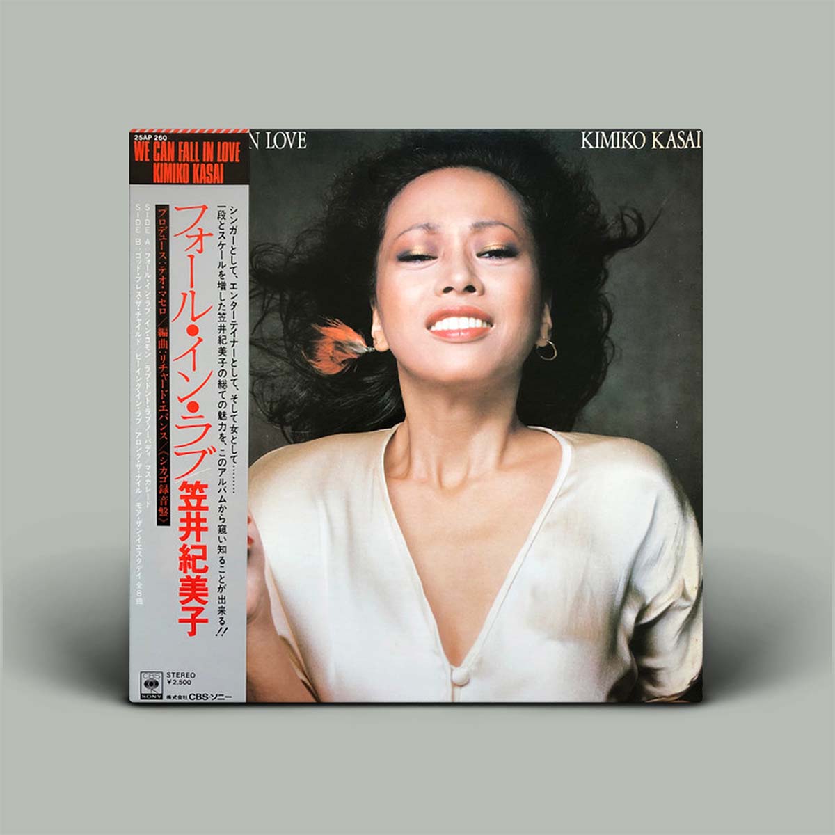 Album cover featuring a woman with text and graphics on a gray background