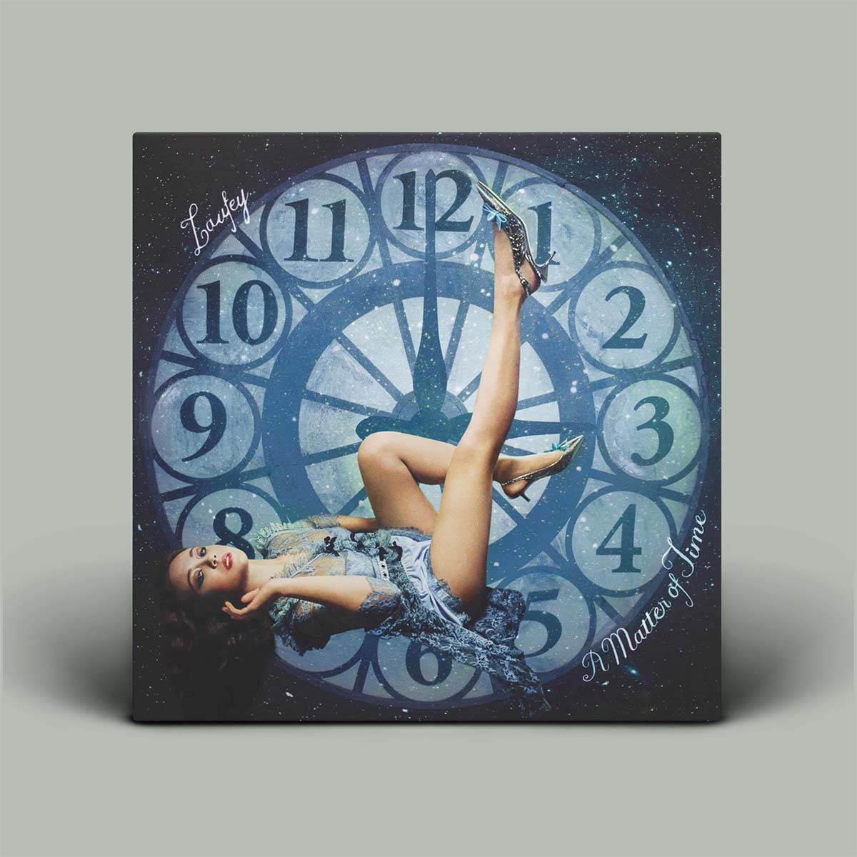 Album cover with a dancer and clock design on a gray background