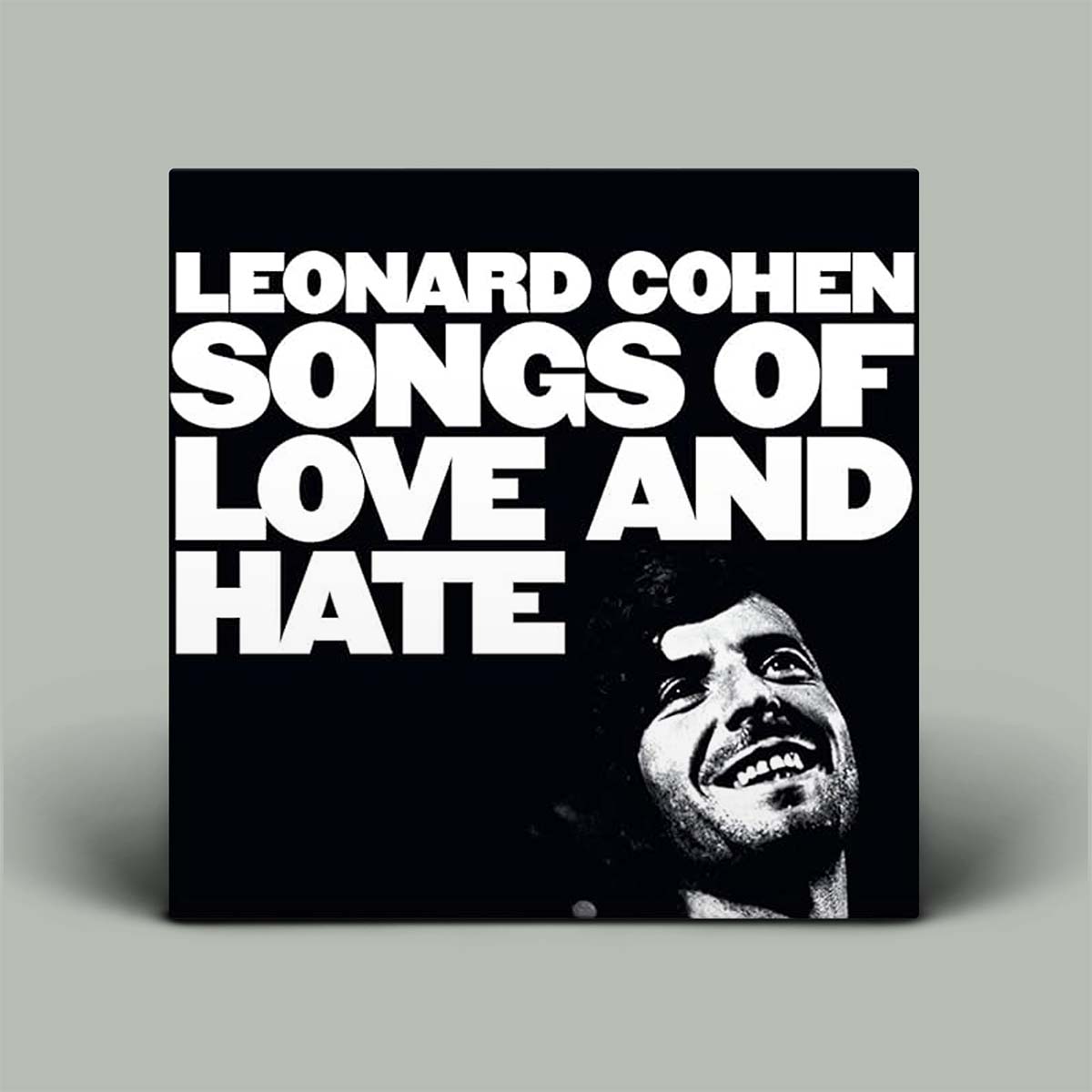 Vinyl record cover for 'Songs of Love and Hate' by Leonard Cohen on a gray background