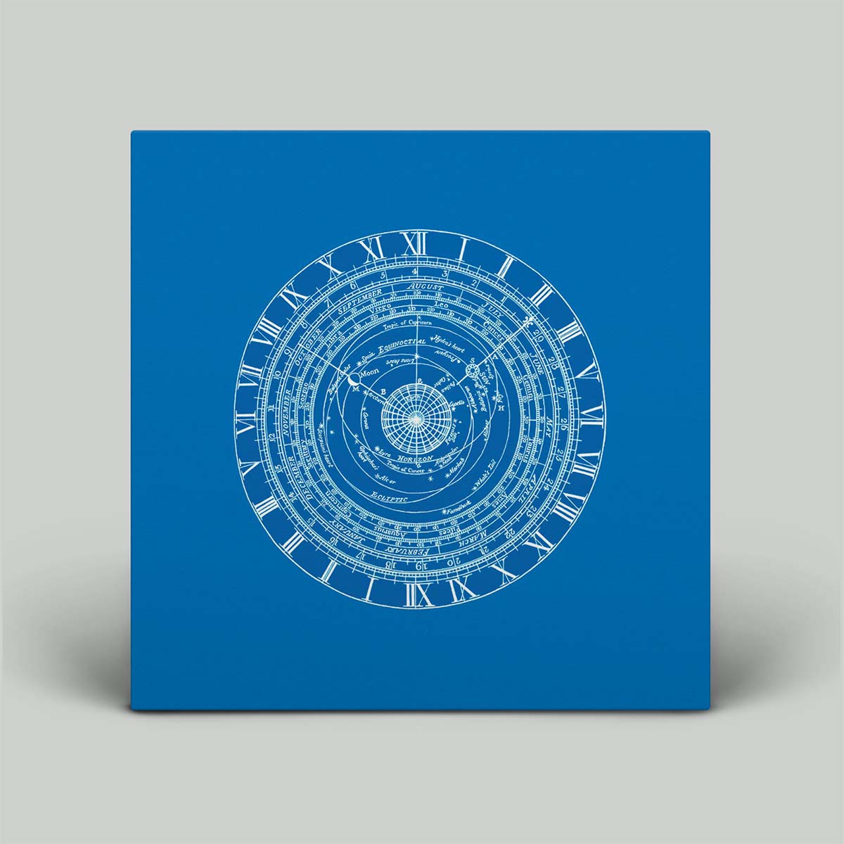 A blue vinyl record titled 'The Rags of Time EP' with a detailed blueprint-style design on the cover.