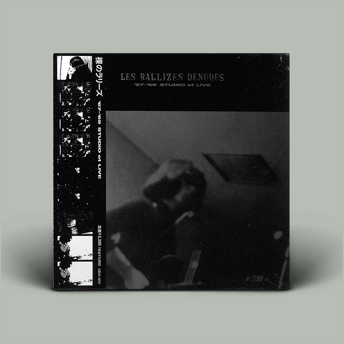 Album cover with black and white design and text on a gray background