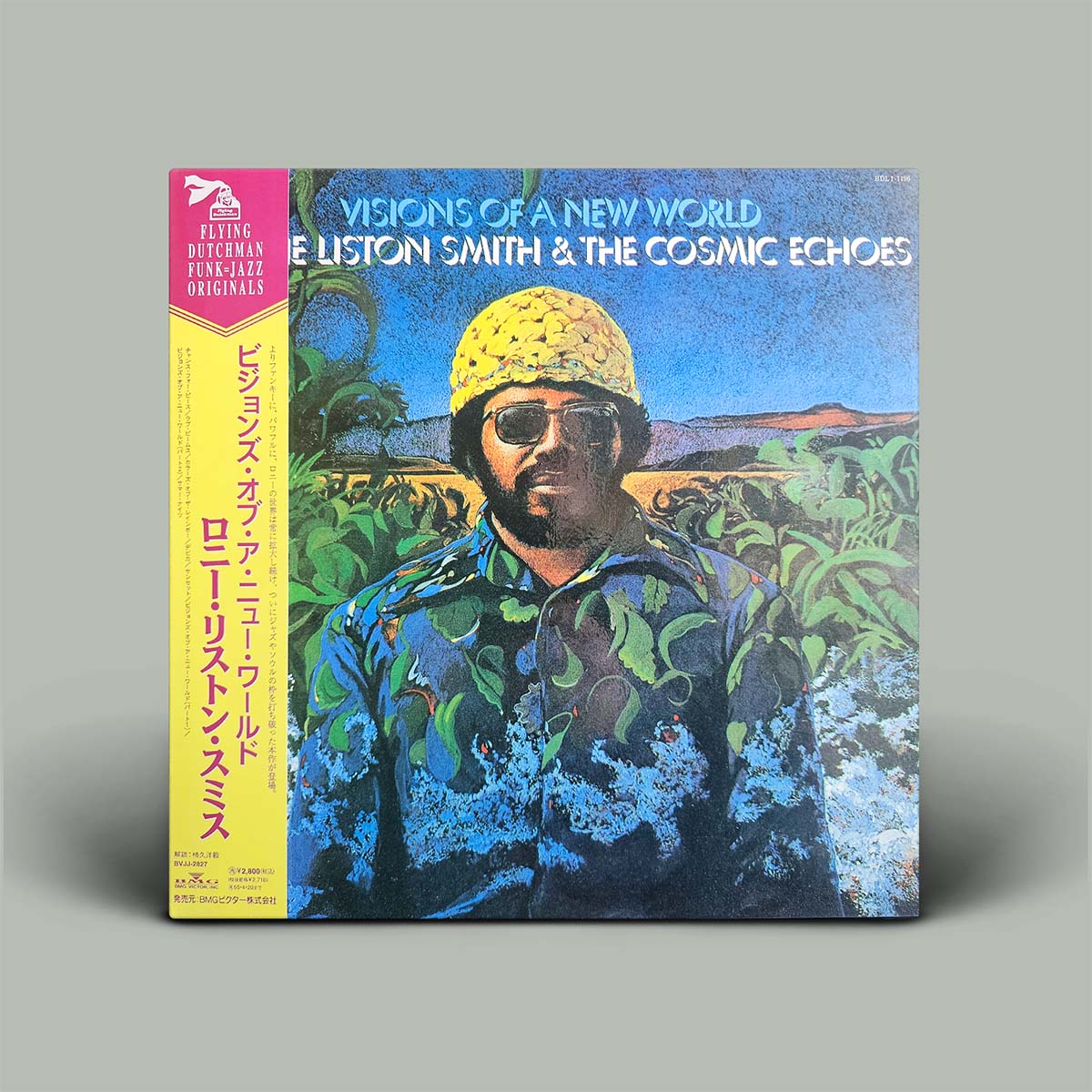 Vinyl record album cover for 'Visions of a New World' by Lonnie Liston Smith & The Cosmic Echoes, featuring a colorful illustrated portrait with a yellow hat and blue clothing, plus a bright pink and yellow Japanese obi strip on the left, shown standing against a plain gray background.
