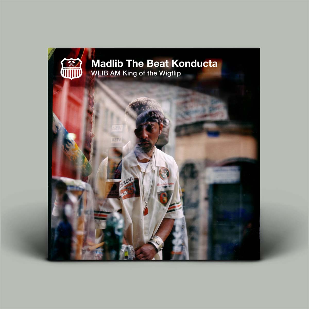 Album cover for 'Madlib The Beat Konducta' with a person in a store setting.