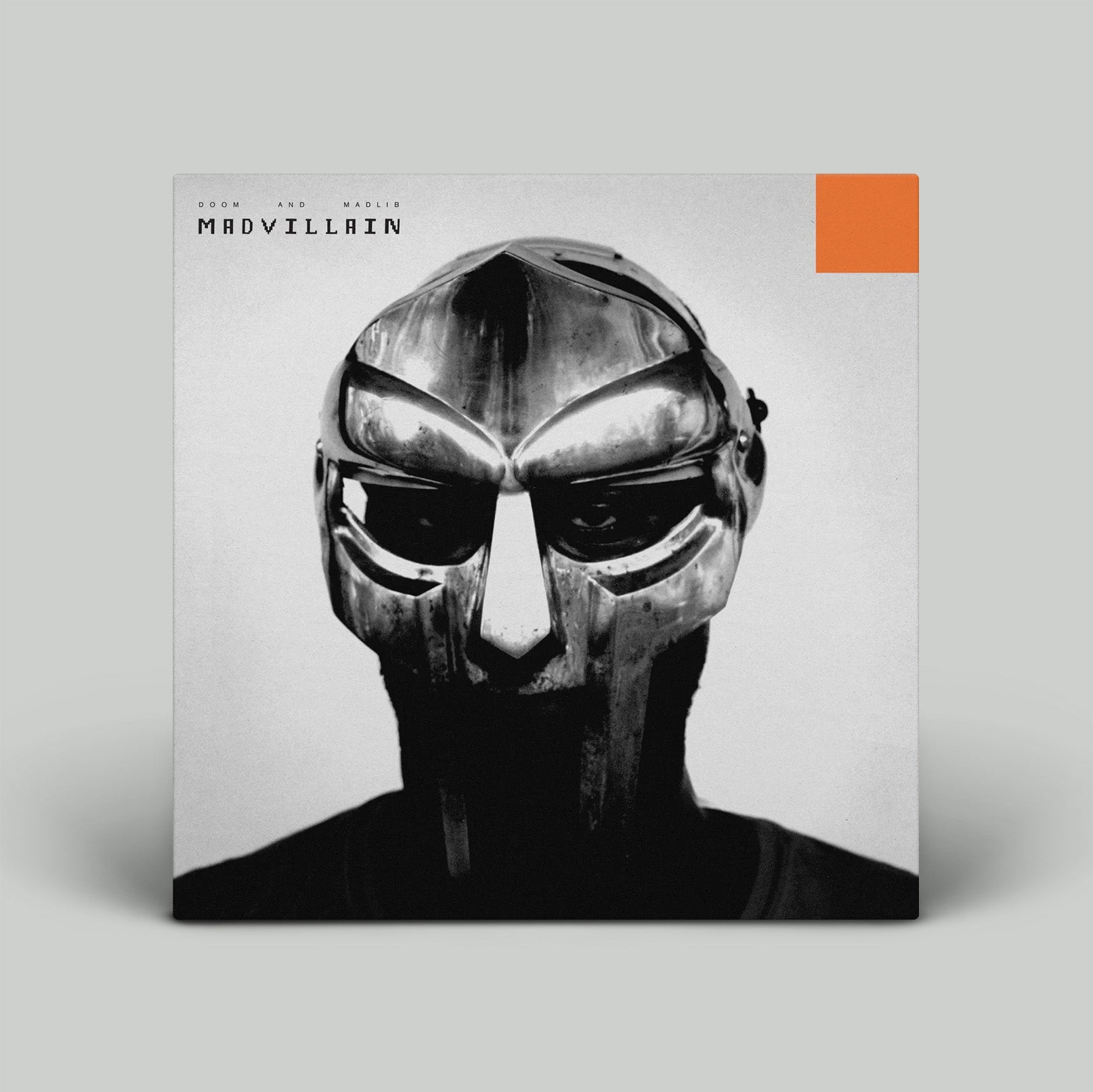 Album cover with a metallic mask design and 'MADVILLAIN' branding on a gray background.