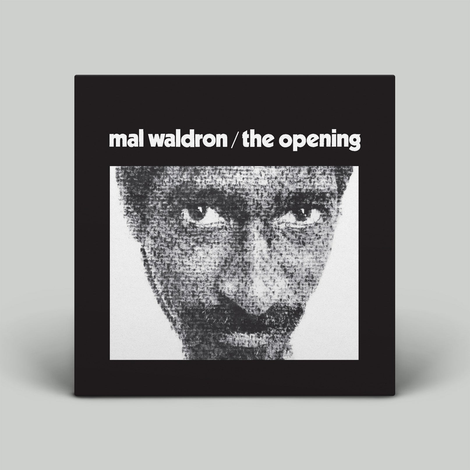 Album cover with black and white portrait and text 'mal waldron / the opening' on a gray background