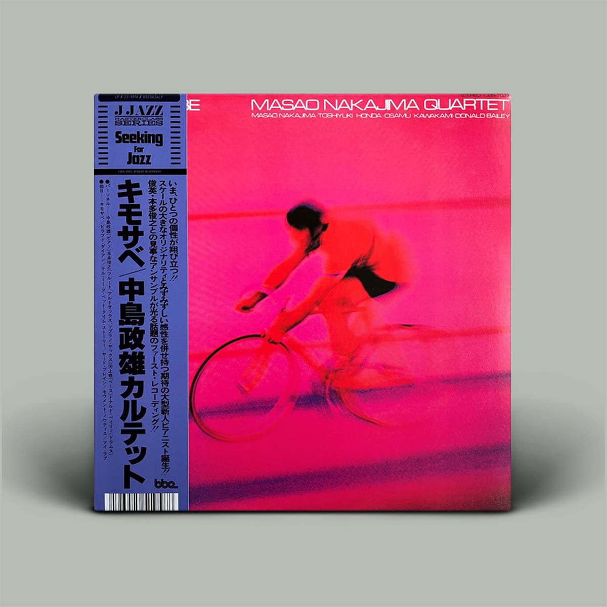 Album cover with a person on a bicycle against a pink background, featuring text and branding.
