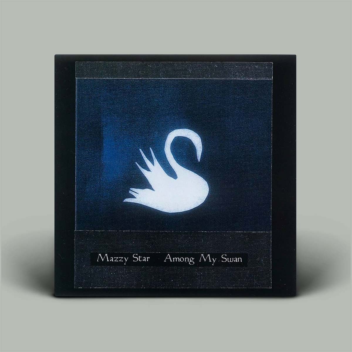 Album cover with a white swan on a blue background, featuring the text 'Mazzy Star Among My Swan'.