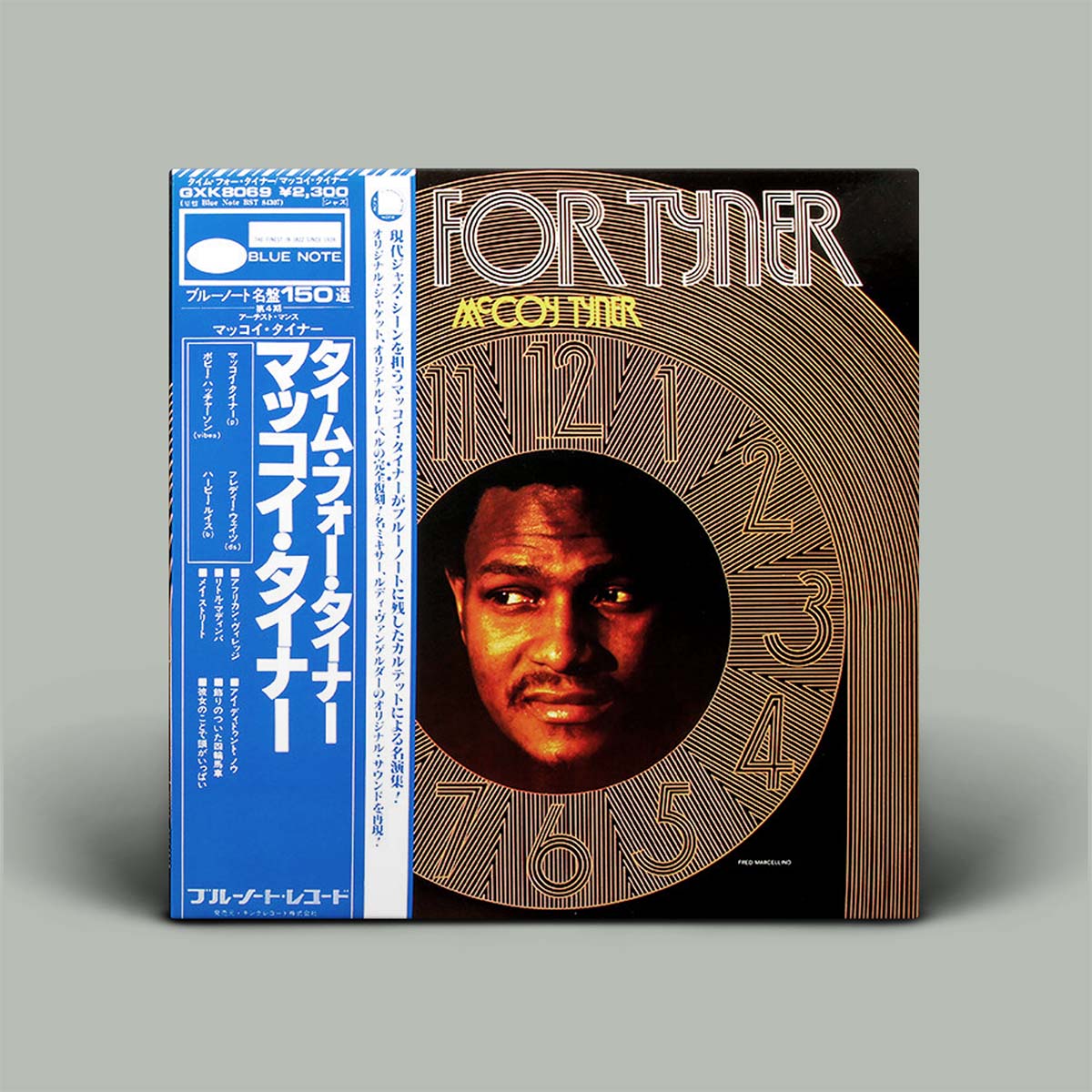 Vinyl record cover with a face on it and text