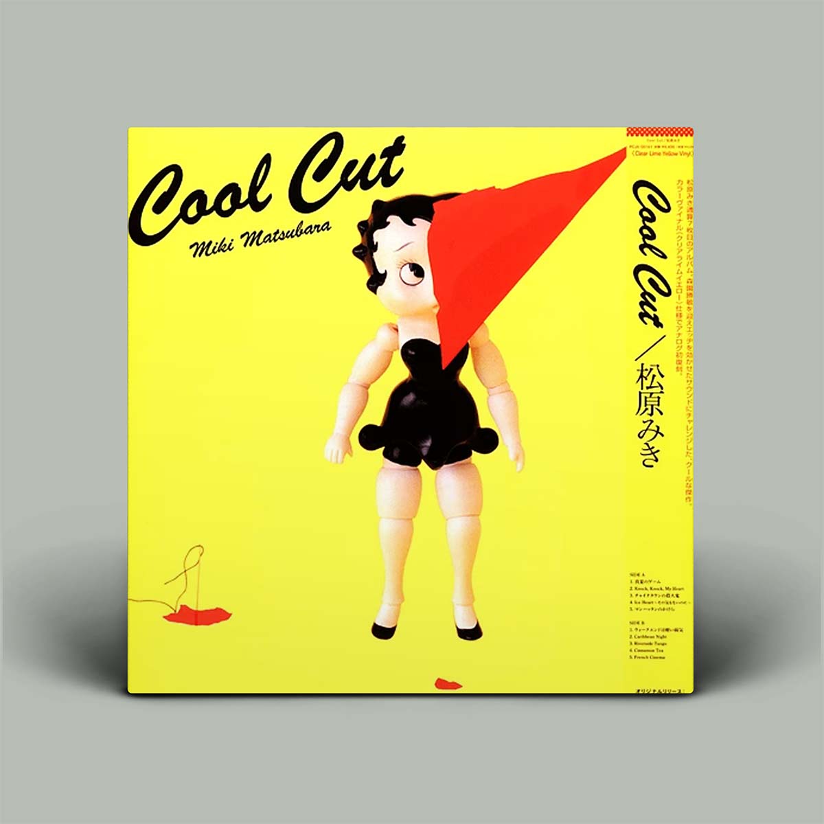 Miki Matubara's 'Cool Cut' vinyl record LP cover, featuring a bright yellow background with a stylized doll wearing a red hat and black dress, set against a neutral gray background.