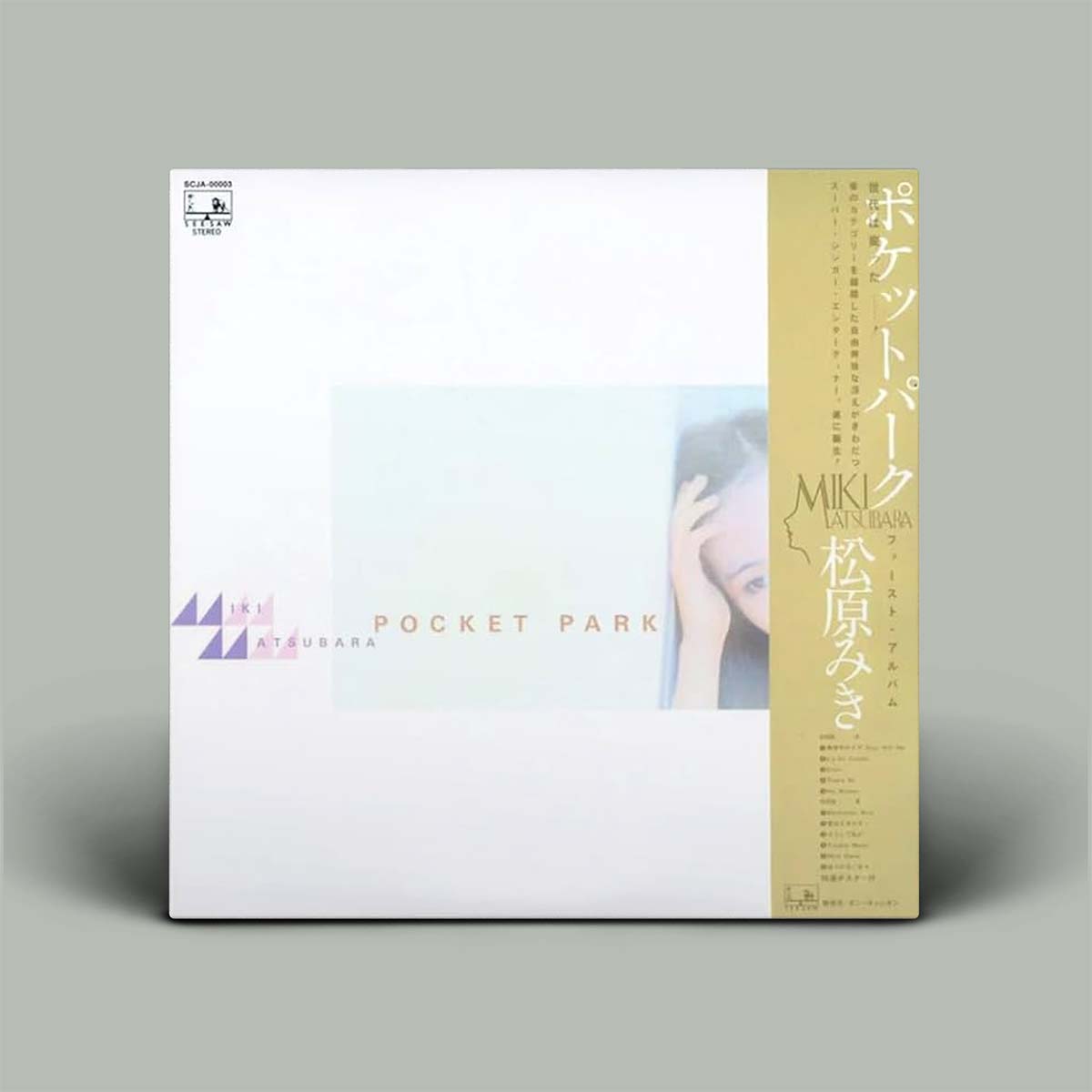 A square album cover for 'Pocket Park' by Miki Mitsubara, featuring a white background with a vertical gold spine band on the right side and a small photo of a woman on the cover.