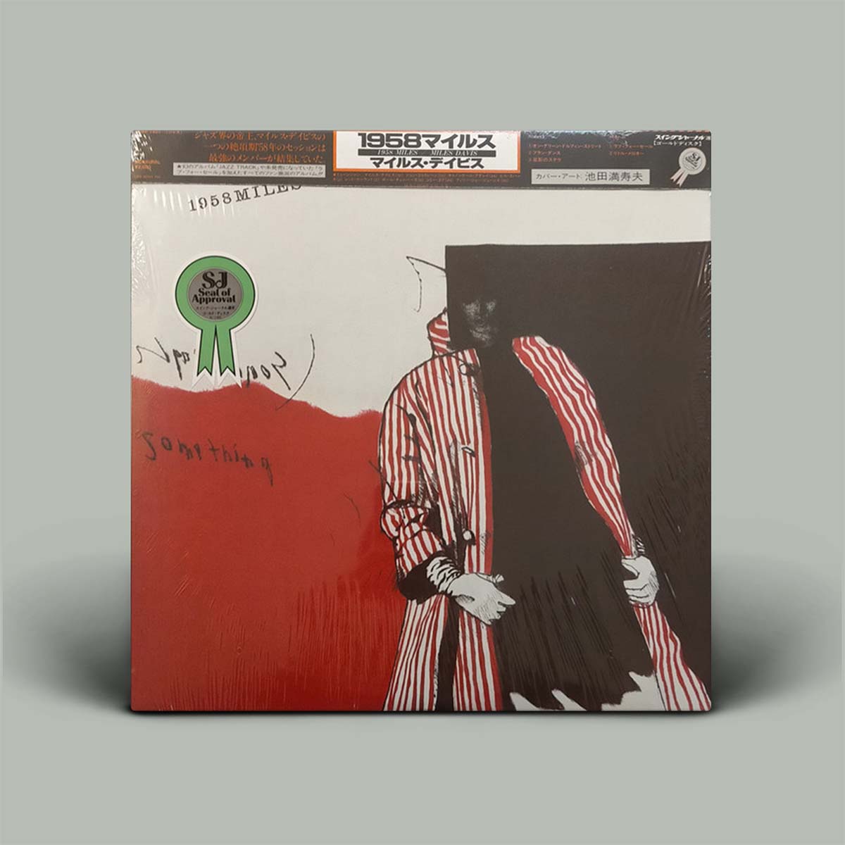 Album cover with red, black and white image on it.