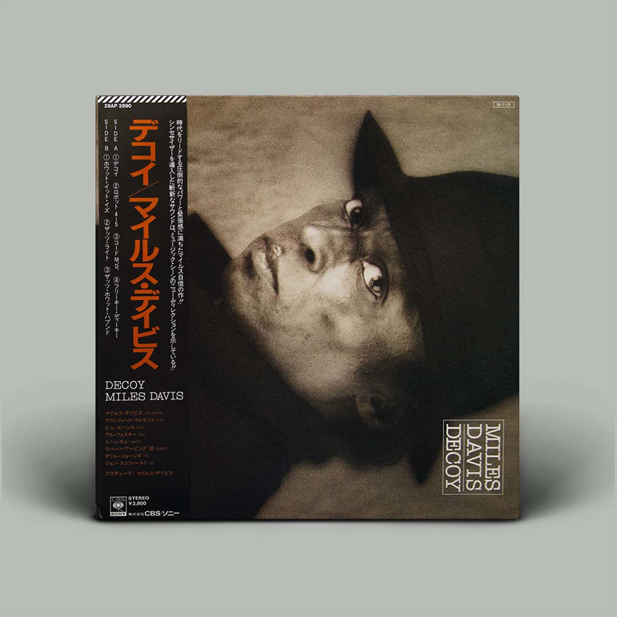 Album cover of 'Decoy' by Miles Davis with a black and white portrait on a gray background