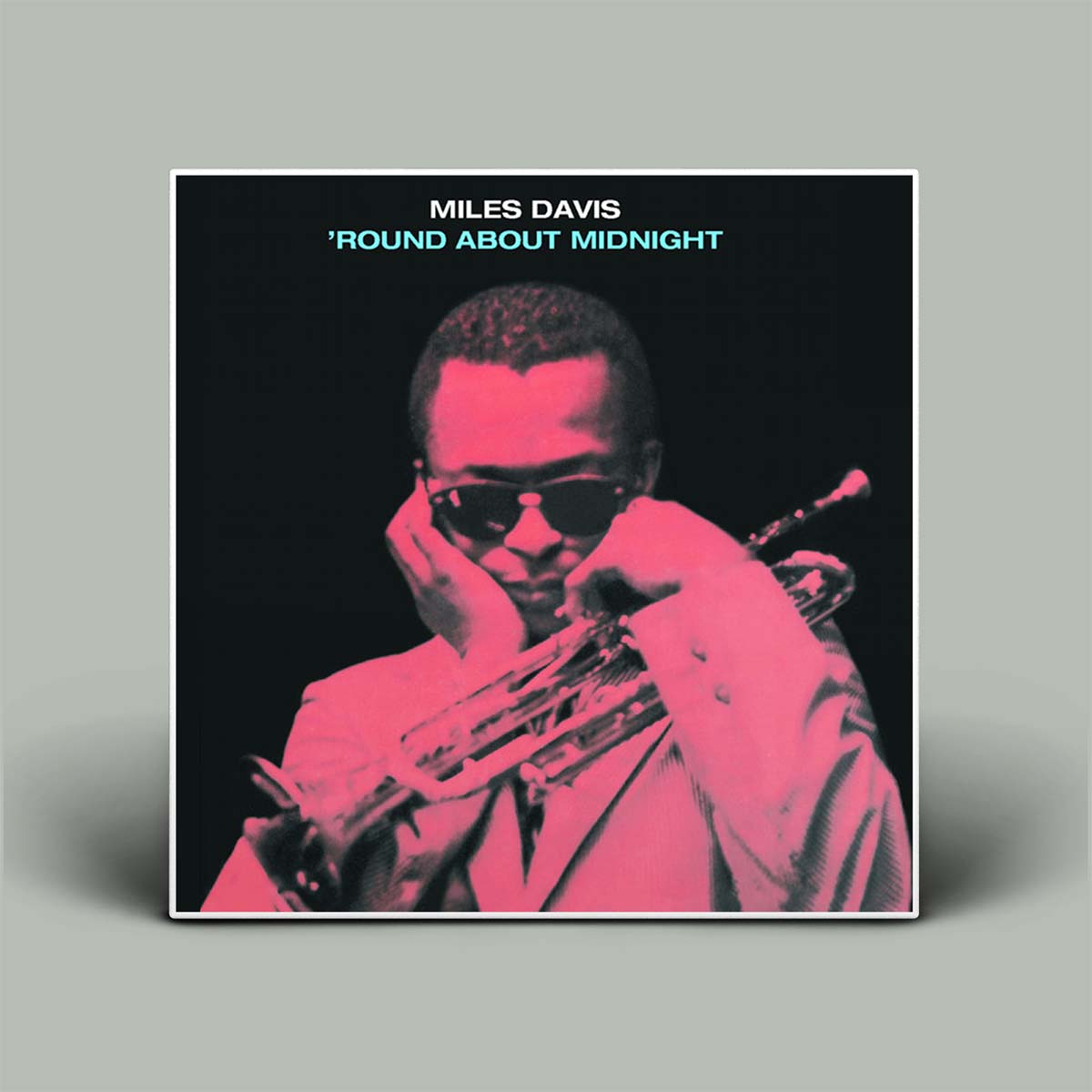 Album cover of 'Round About Midnight by Miles Davis with a portrait of the musician holding a trumpet.