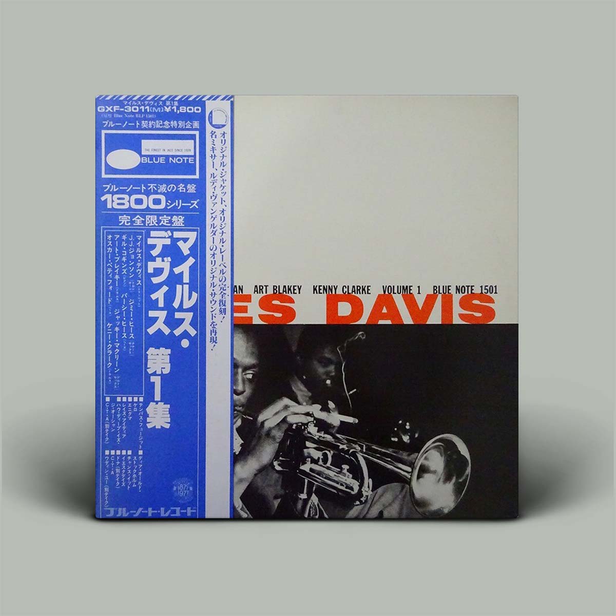 Album cover with blue obi and black and white photo of artist playing trumpet.