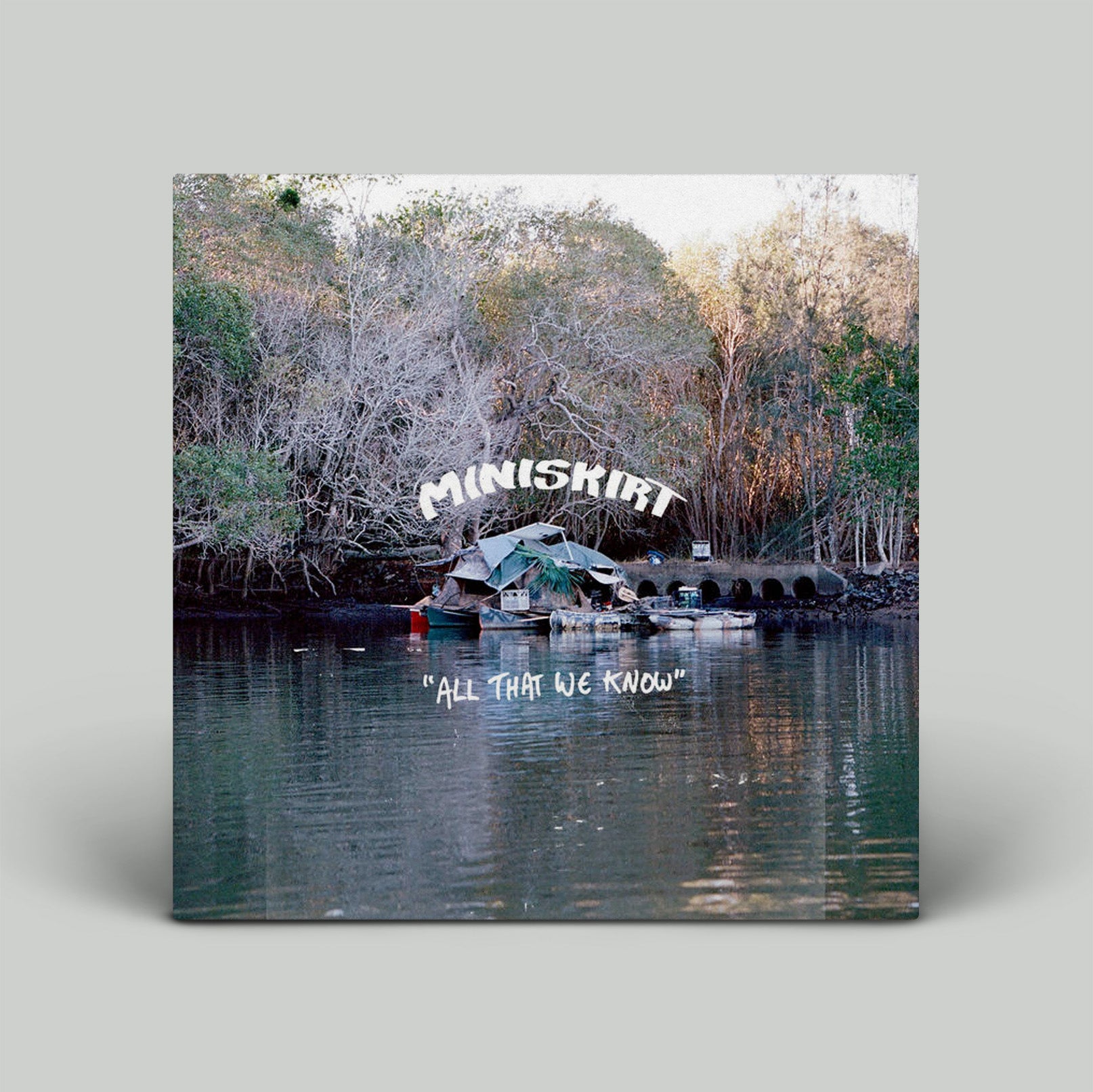 Album cover with 'Miniskirt' and 'All That We Know' text over a forest and water scene.