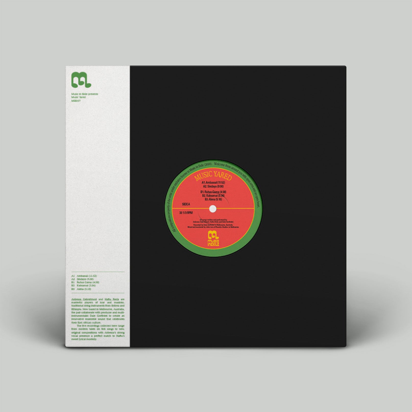 Vinyl record with a black cover and red label on a gray background