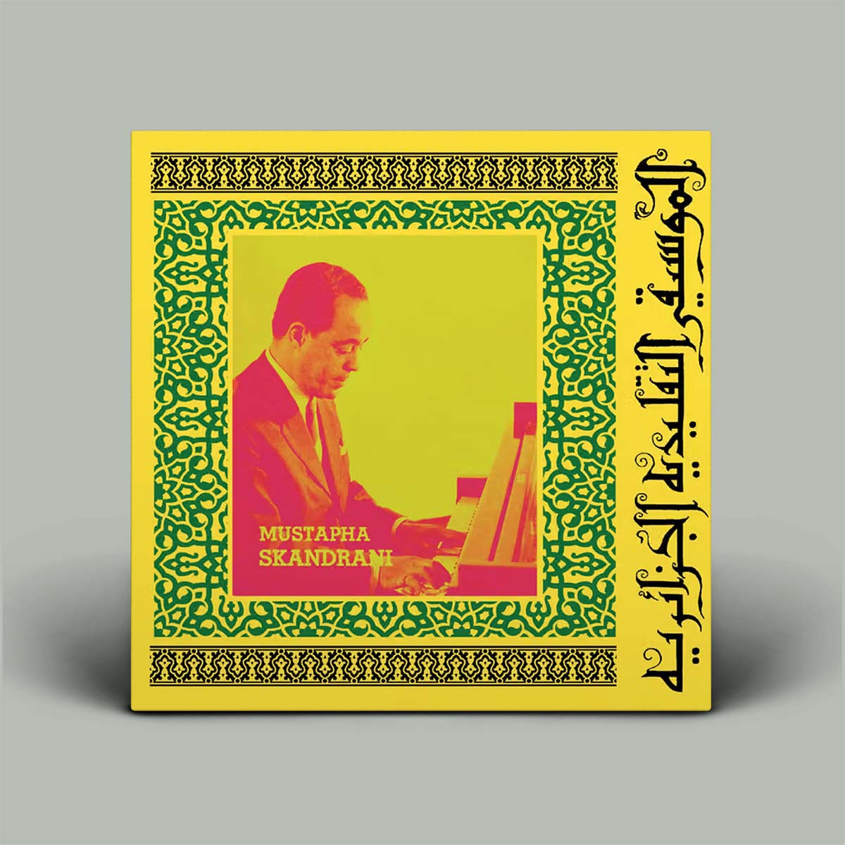Album cover with a person playing piano and intricate patterns on a yellow background