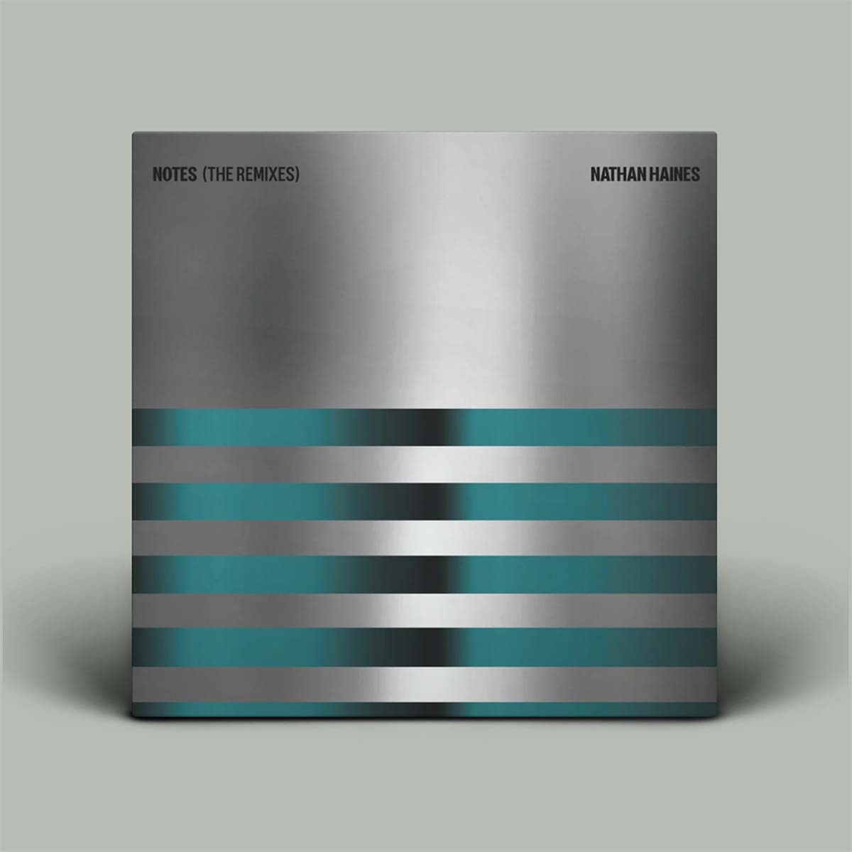 Album cover with metallic and striped design on a gray background