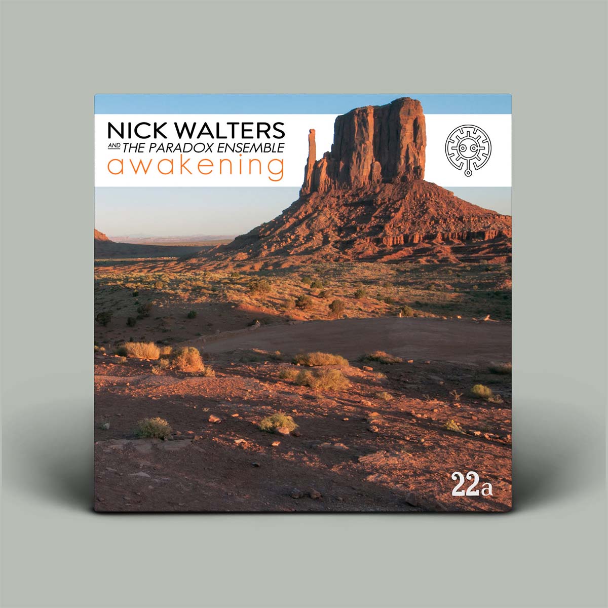 Album cover for 'awakening' by Nick Walters and The Paradox Ensemble, featuring a desert landscape with Monument Valley rock formations. The cover is displayed as a physical CD case against a solid gray background.
