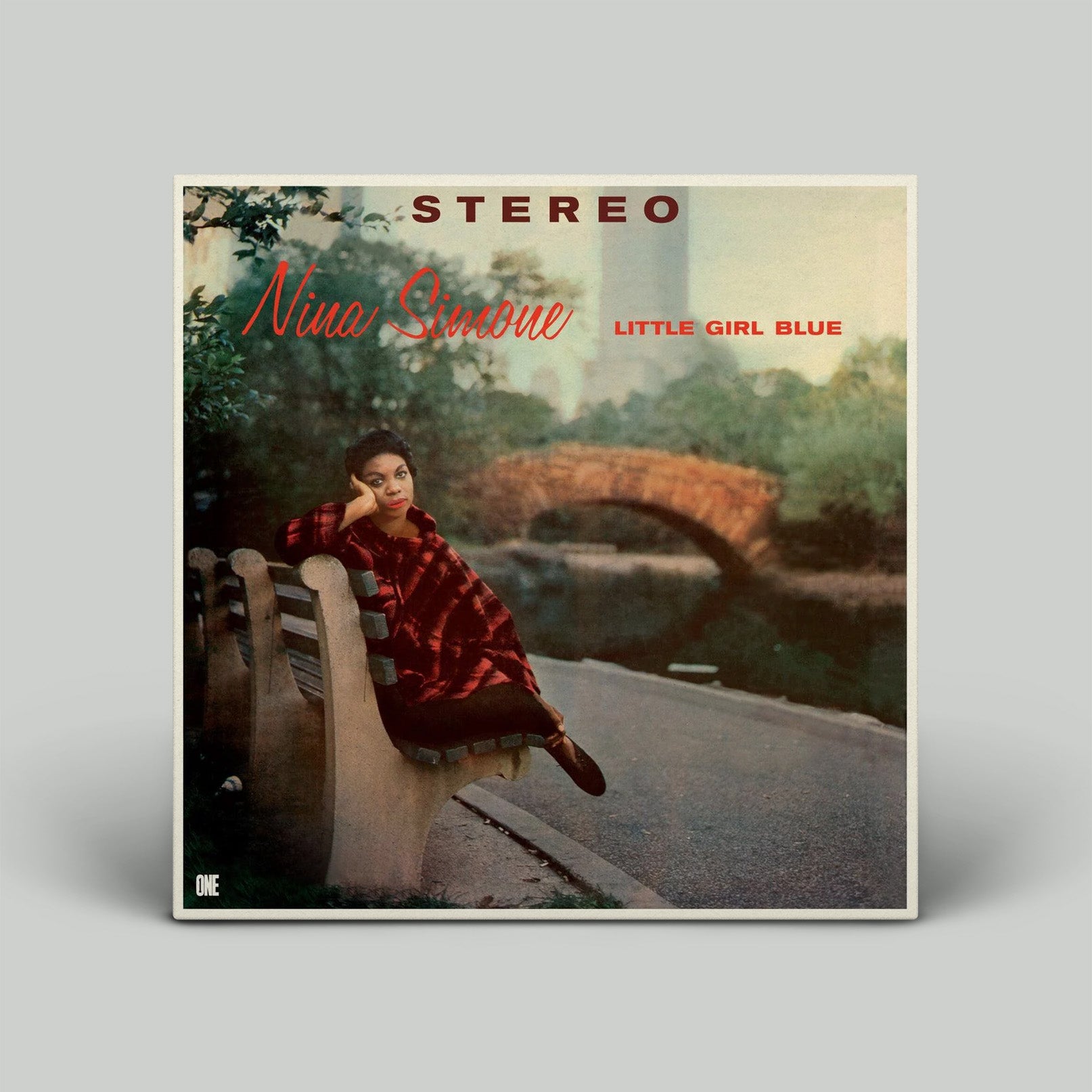 Album cover of Nina Simone's 'Little Girl Blue' with a woman sitting on a bridge.