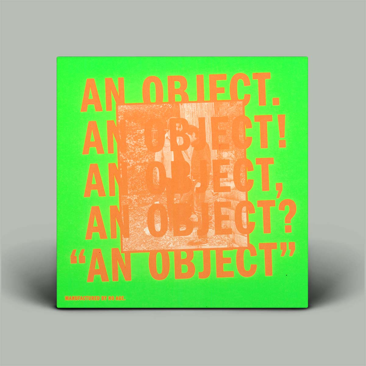 Green album cover with orange text on a gray background