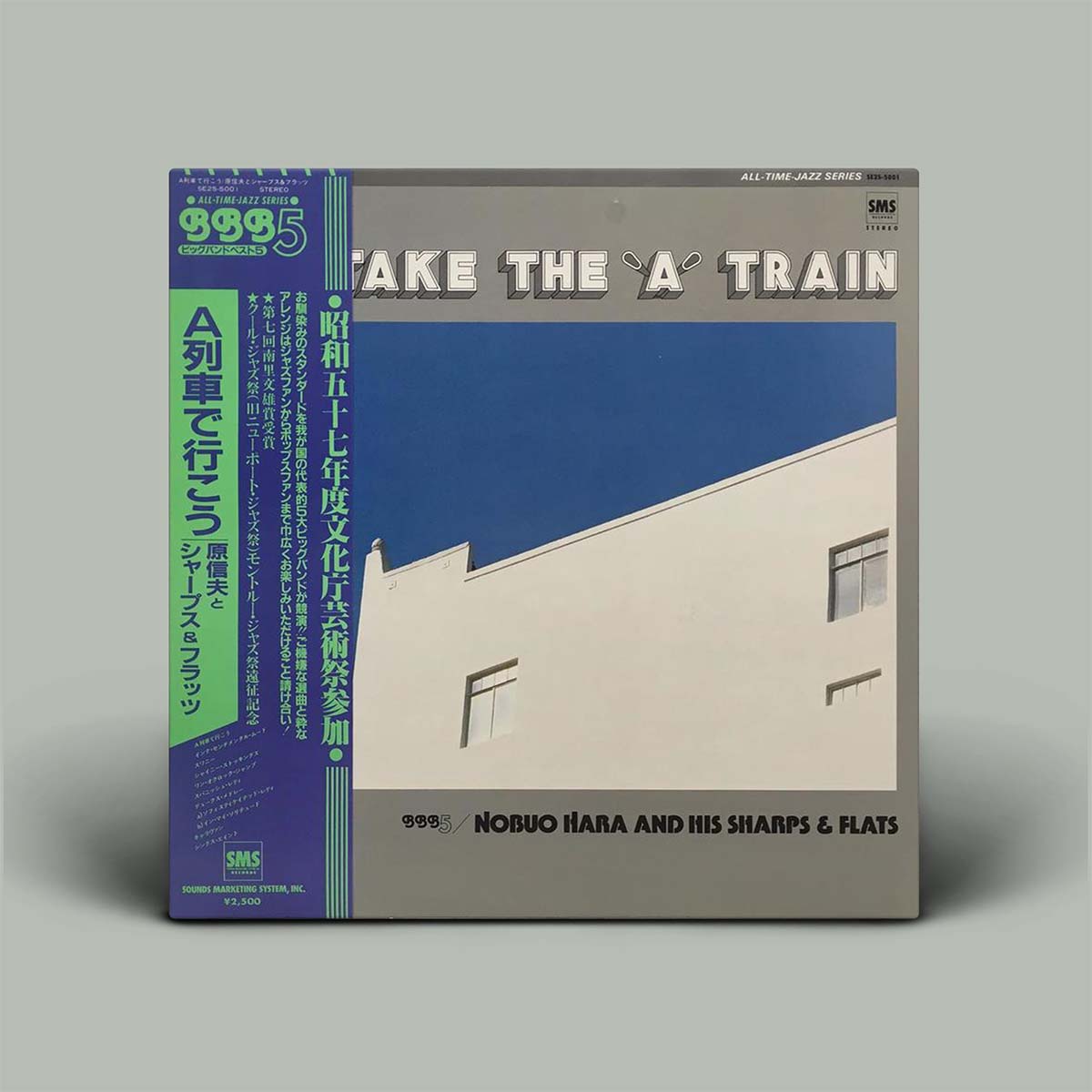 Album cover with a building image and text on a gray background